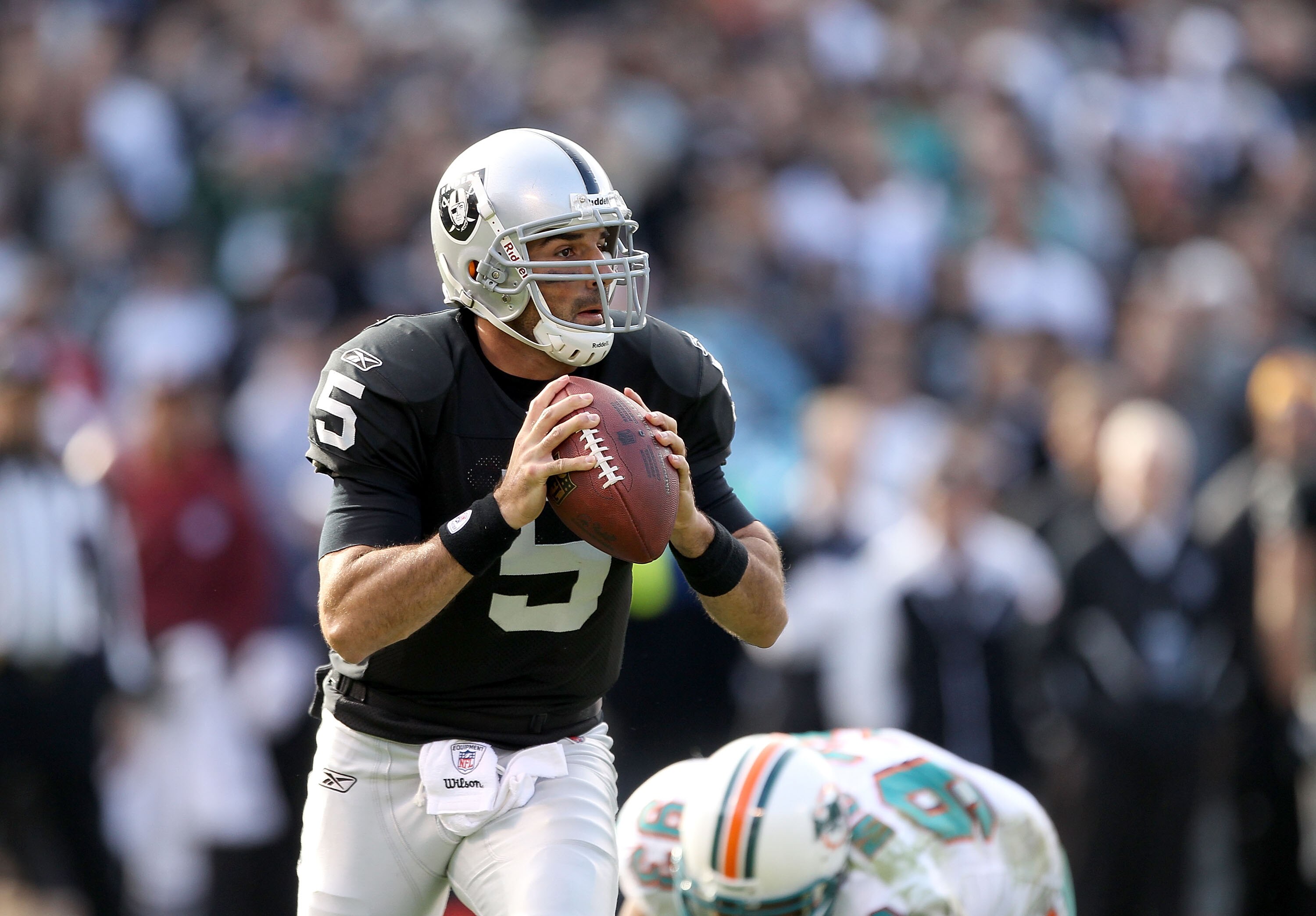 OAKLAND, CA - NOVEMBER 28:  Bruce Gradkowski #5 of the Oakland Raiders in action against the Miami Dolphins at Oakland-Alameda County Coliseum on November 28, 2010 in Oakland, California.  (Photo by Ezra Shaw/Getty Images)