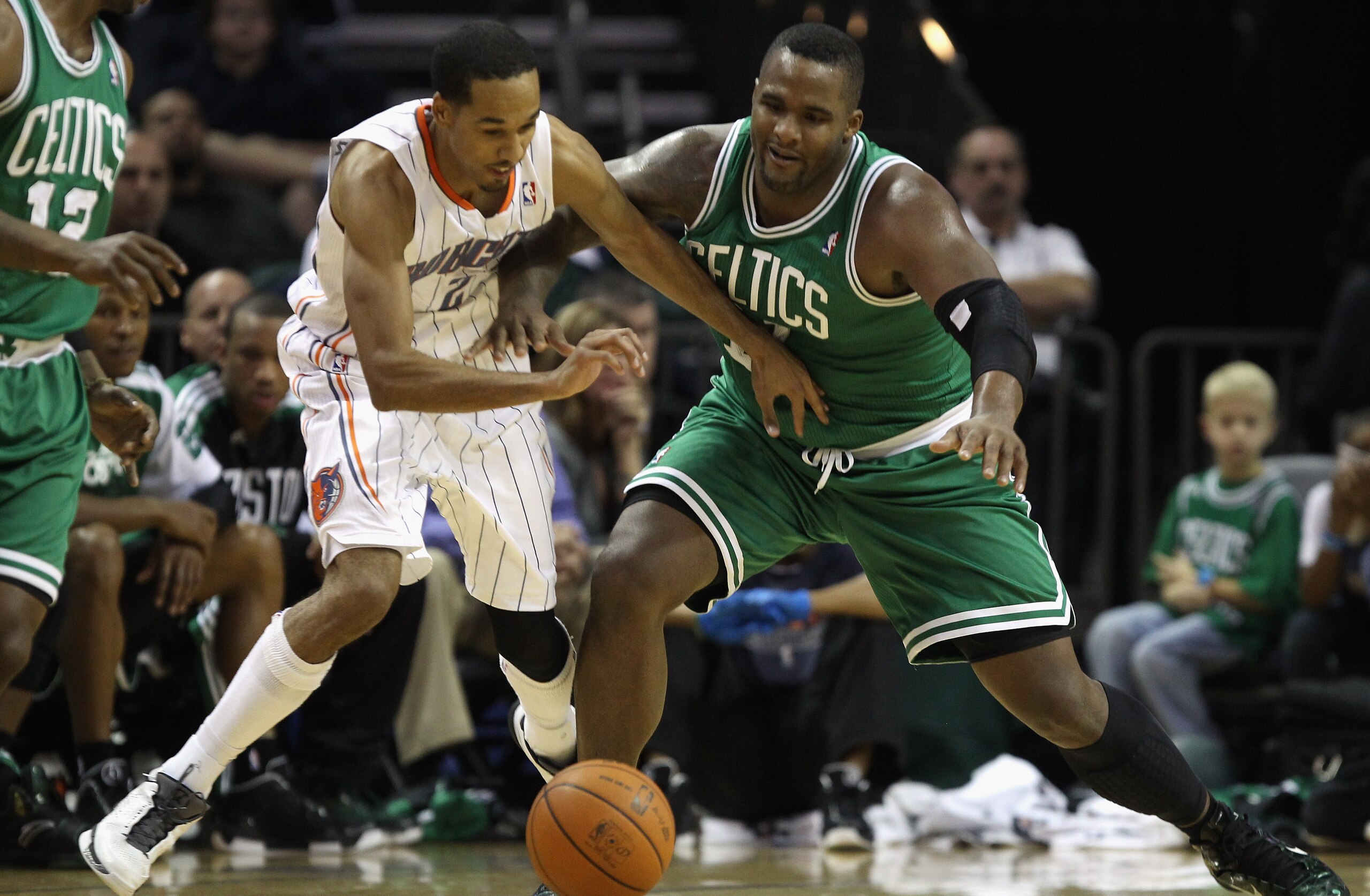 CHARLOTTE, NC - DECEMBER 11:  Glen Davis #11 of the Boston Celtics battles for a loose ball with Shaun Livingston #2 of the Charlotte Bobcats during their game at Time Warner Cable Arena on December 11, 2010 in Charlotte, North Carolina. NOTE TO USER: Use