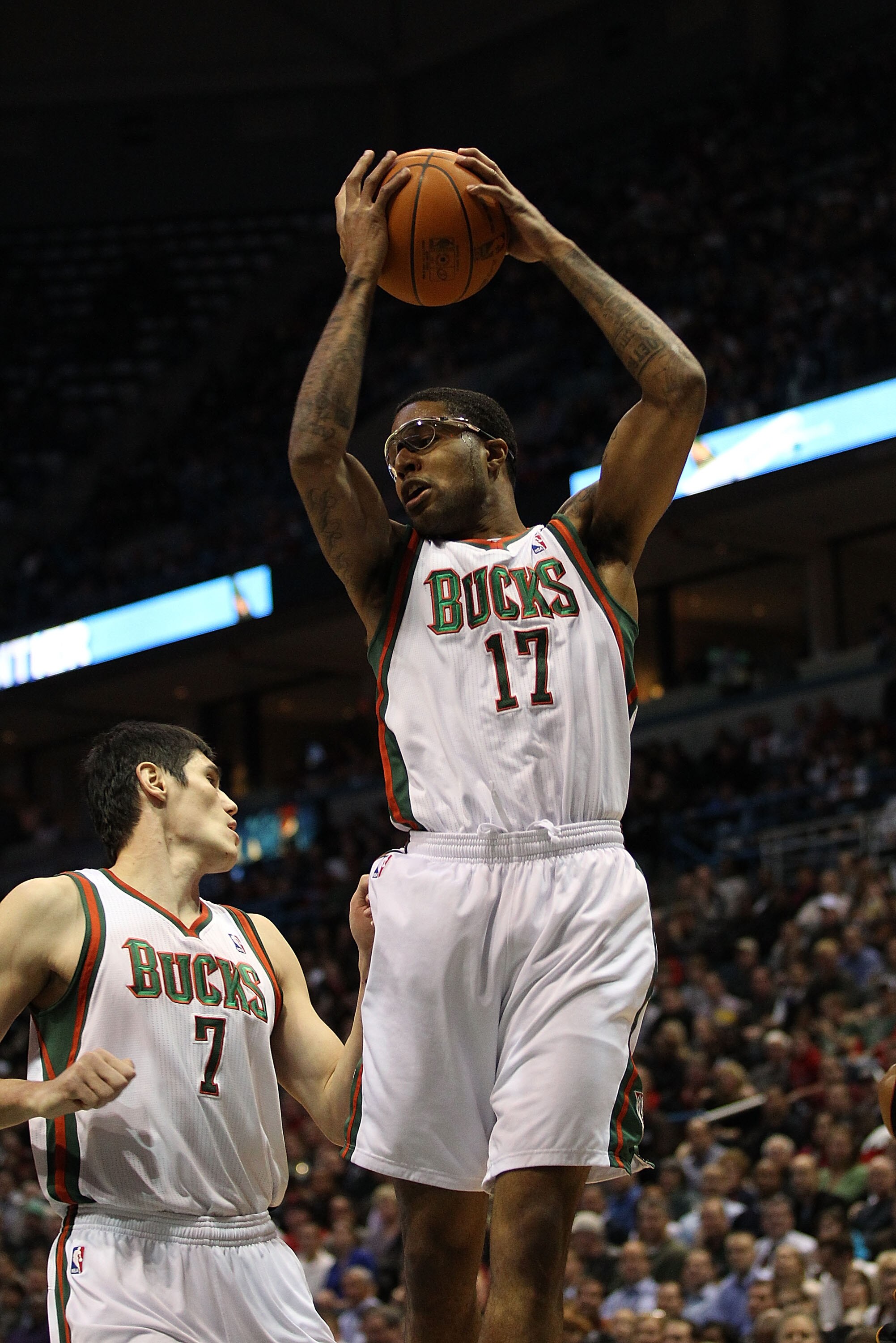 MILWAUKEE, WI - DECEMBER 06: Chris Douglas-Roberts #17 of the Milwaukee Bucks grabs a rebound over teammate Ersan Ilyasova #7 against the Miami Heat at the Bradley Center on December 6, 2010 in Milwaukee, Wisconsin. The Heat defeated the Bucks 88-78. NOTE