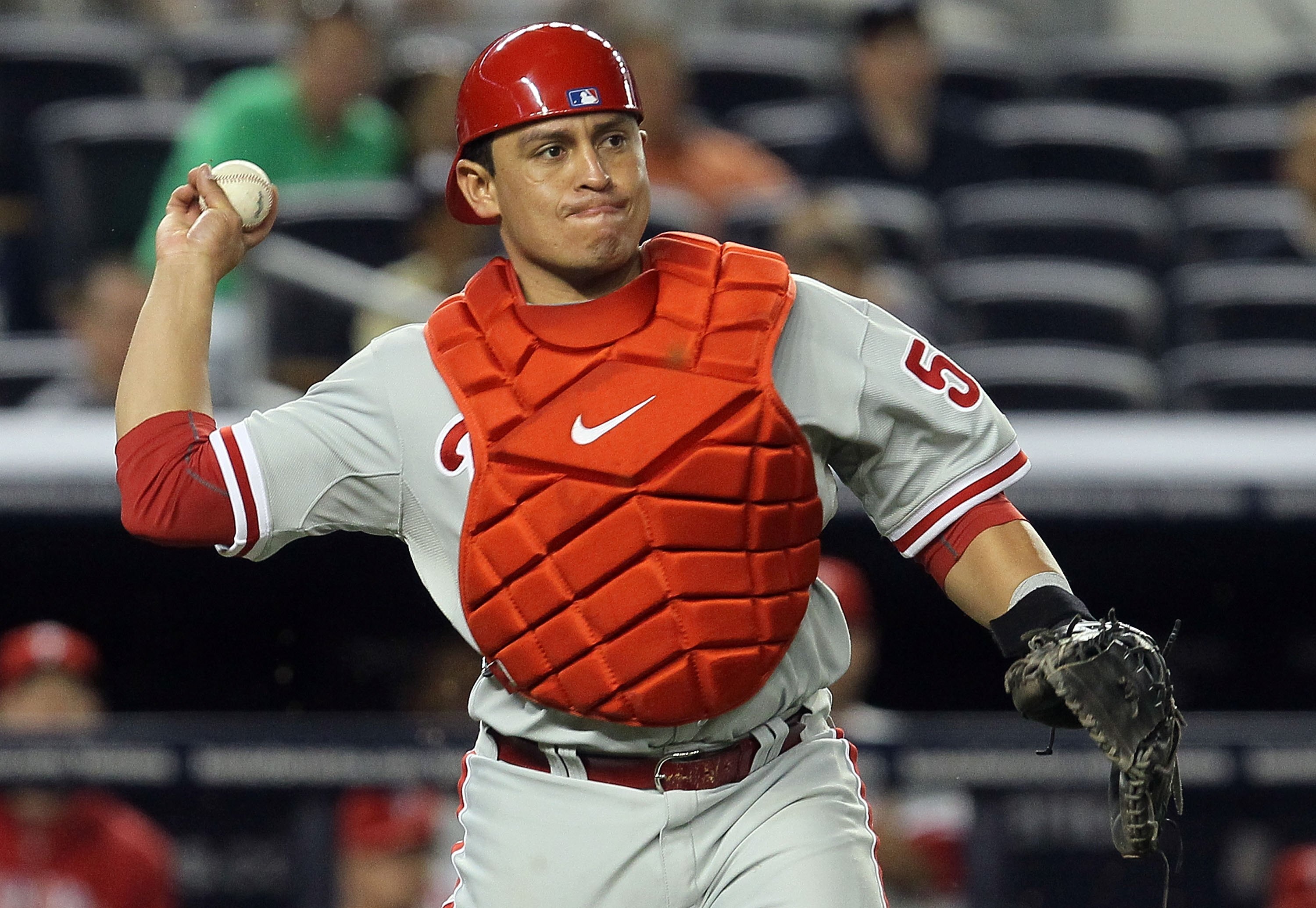NEW YORK - JUNE 17:  Carlos Ruiz #51 of the Philadelphia Phillies throws to first base against the New York Yankees on June 17, 2010 at Yankee Stadium in the Bronx borough of New York City. The Phillies defeated the Yankees 7-1.  (Photo by Jim McIsaac/Get