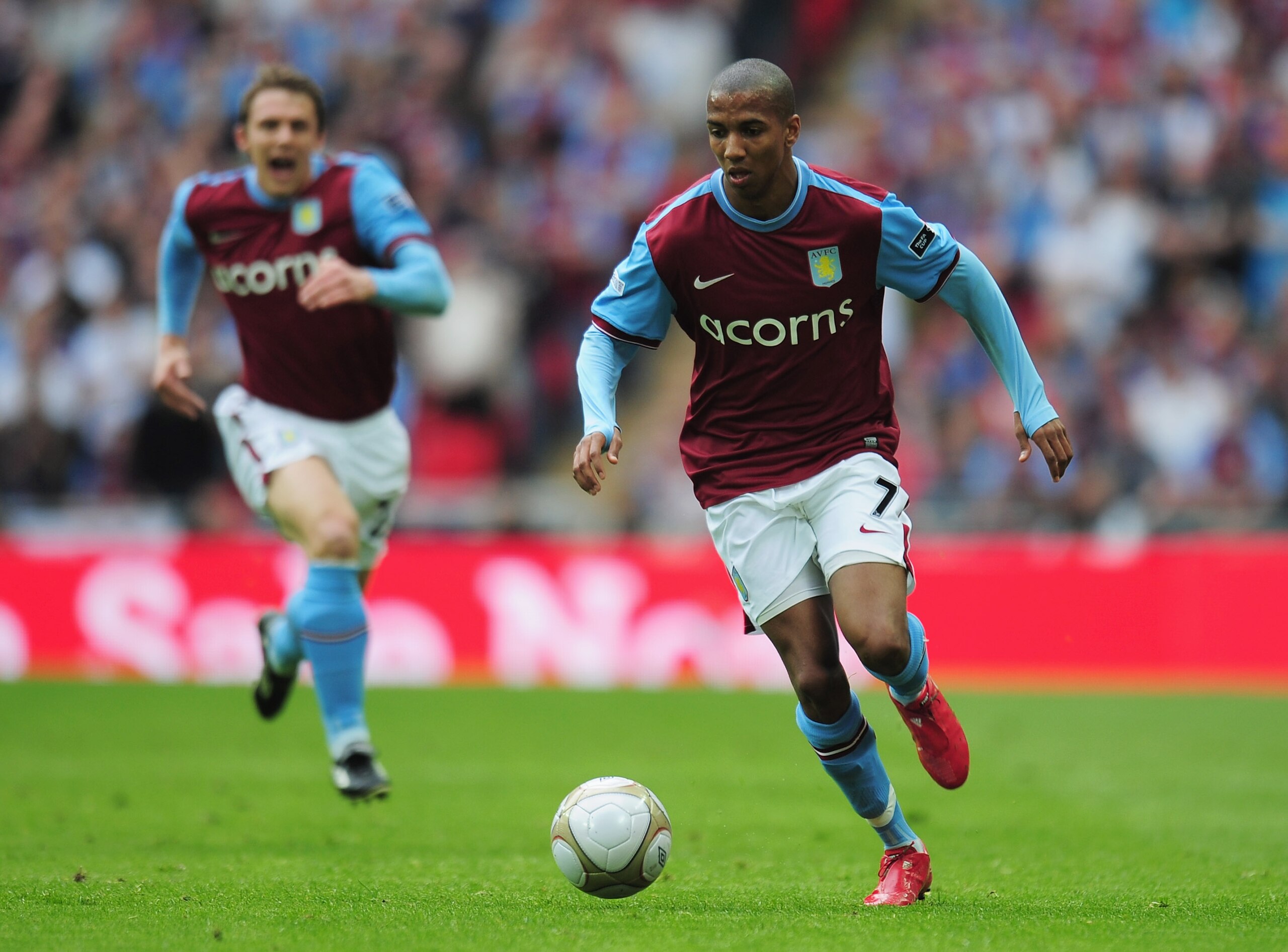 LONDON, ENGLAND - APRIL 10:  Ashley Young of Aston Villa runs with the ball as team mate Stephen Warnock supports during the FA Cup sponsored by E.ON Semi Final match between Aston Villa and Chelsea at Wembley Stadium on April 10, 2010 in London, England.