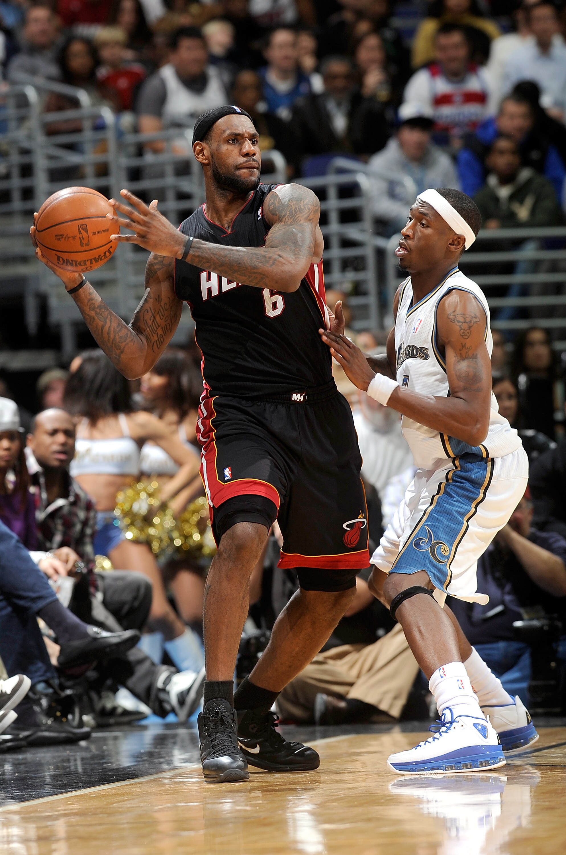 WASHINGTON, DC - DECEMBER 18:  LeBron James #6 of the Miami Heat handles the ball against Josh Howard #5 of the Washington Wizards at the Verizon Center on December 18, 2010 in Washington, DC. NOTE TO USER: User expressly acknowledges and agrees that, by