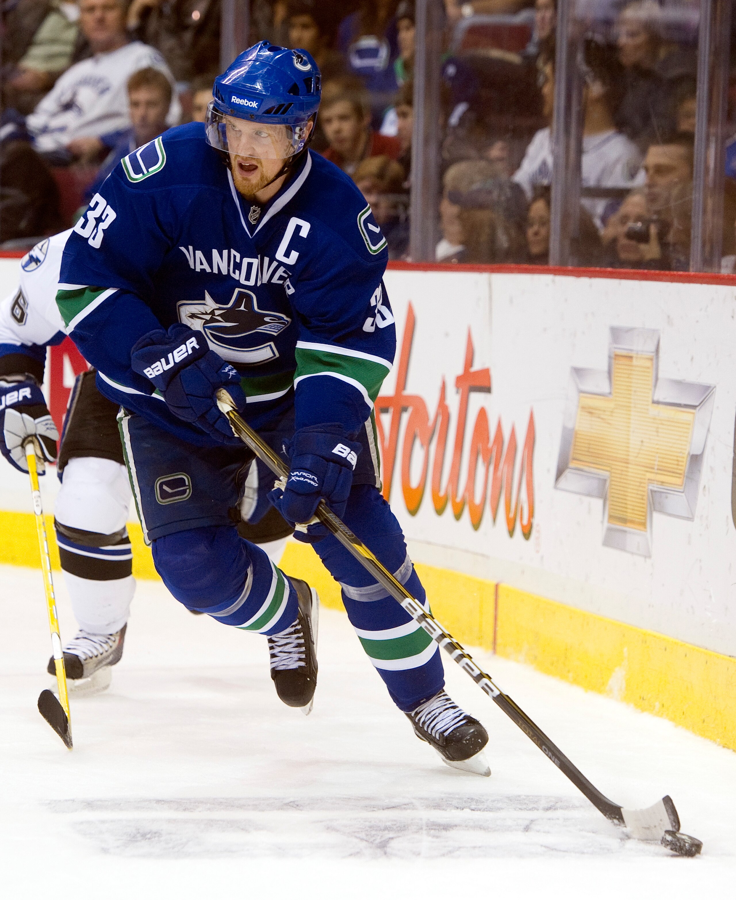 VANCOUVER, CANADA - DECEMBER 11: Henrik Sedin #33 of the Vancouver Canucks skates with the puck during NHL action on December 11, 2010 against the Tampa Bay Lightning at Rogers Arena in Vancouver, BC, Canada. (Photo by Rich Lam/Getty Images) VANCOUVER, CANADA - DECEMBER 11: Henrik Sedin #33 of the Vancouver Canucks skates with the puck during NHL action on December 11, 2010 against the Tampa Bay Lightning at Rogers Arena in Vancouver, BC, Canada. (Photo by Rich Lam/Getty Images)