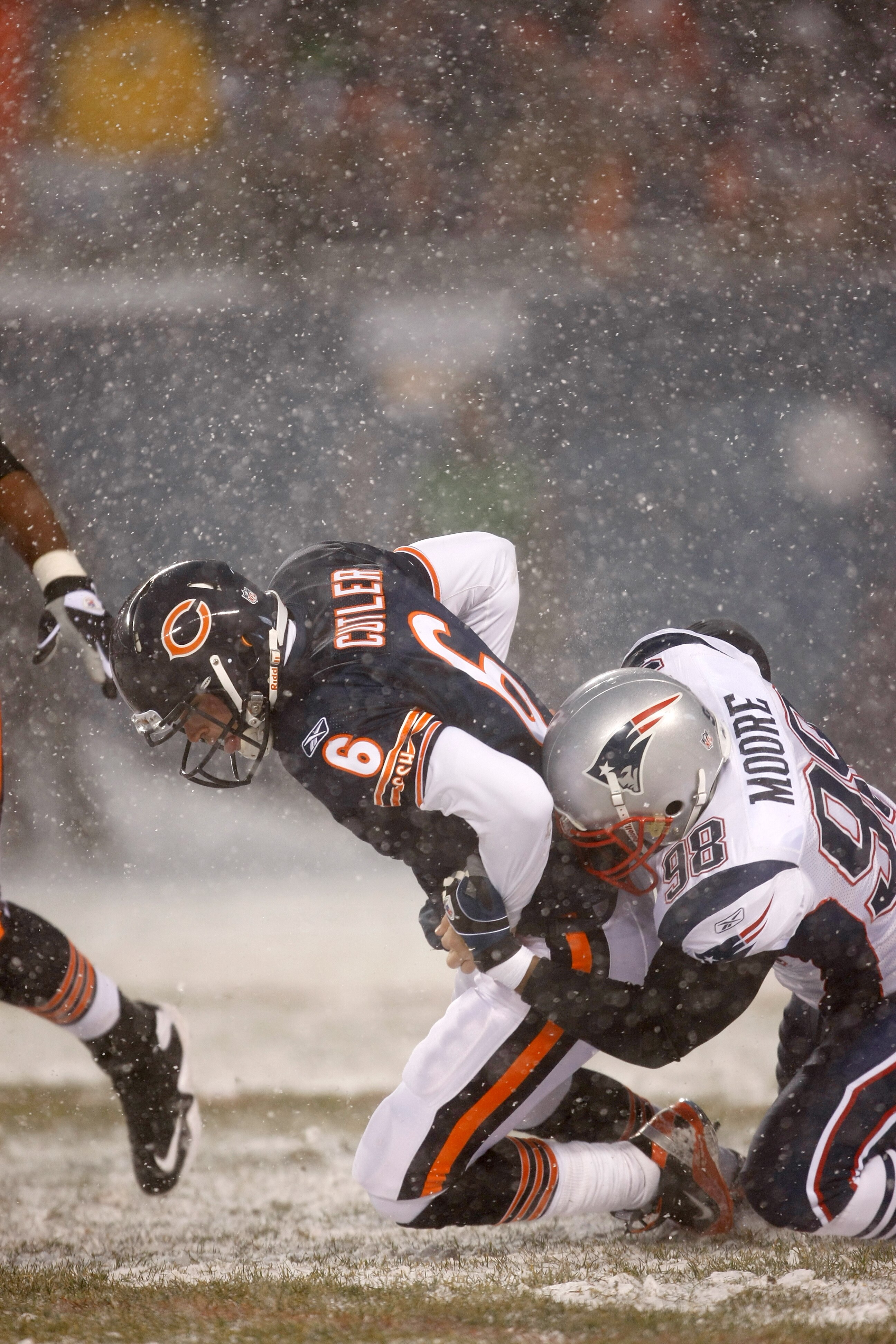 CHICAGO, IL - DECEMBER 12: Eric Moore #98 of the New England Patriots sacks quarterback Jay Cutler #6 of the Chicago Bears at Soldier Field on December 12, 2010 in Chicago, Illinois. The Patriots defeated the Bears 36-7. (Photo by Scott Boehm/Getty Images