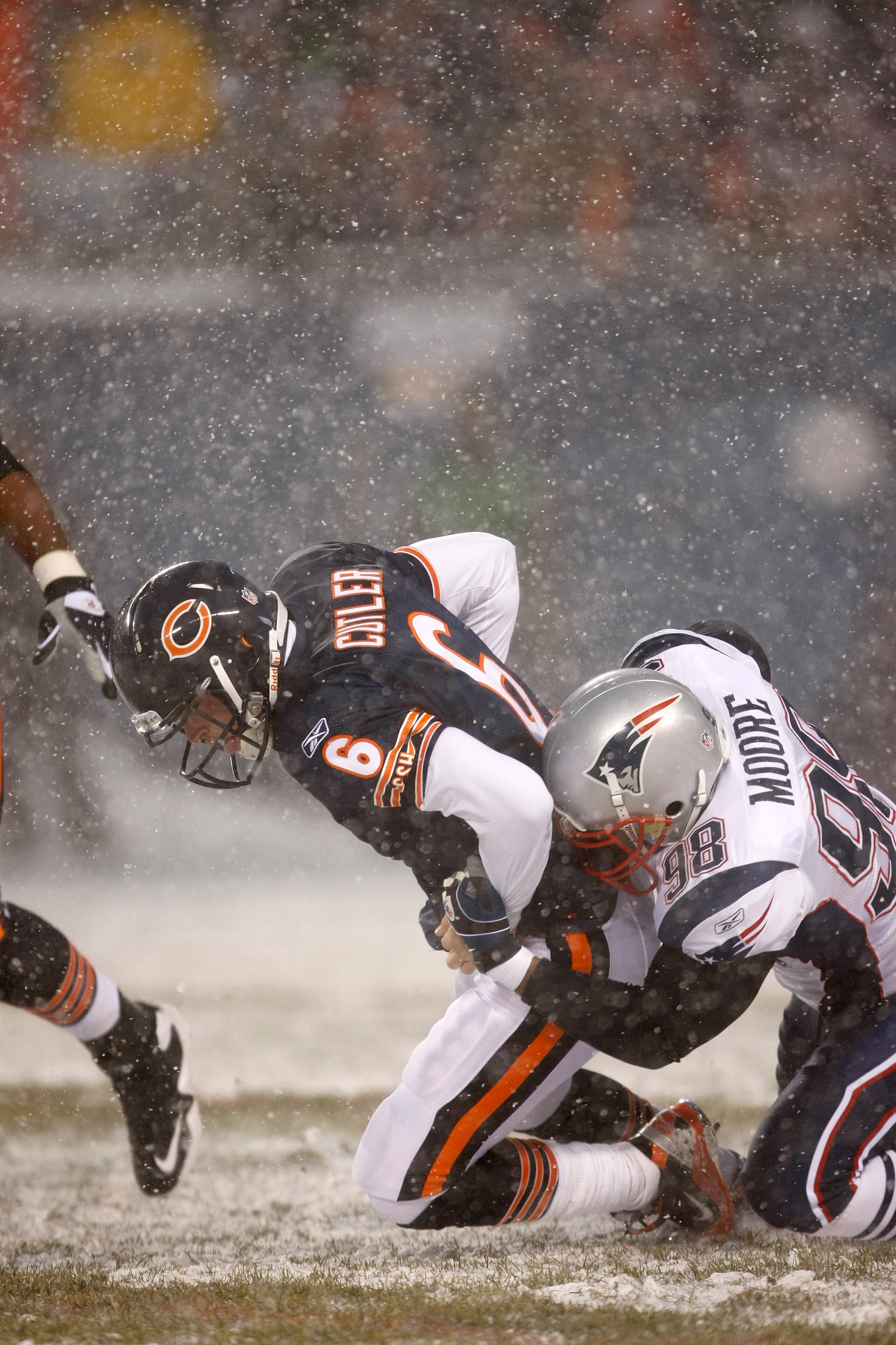 CHICAGO, IL - DECEMBER 12: Eric Moore #98 of the New England Patriots sacks quarterback Jay Cutler #6 of the Chicago Bears at Soldier Field on December 12, 2010 in Chicago, Illinois. The Patriots defeated the Bears 36-7. (Photo by Scott Boehm/Getty Images