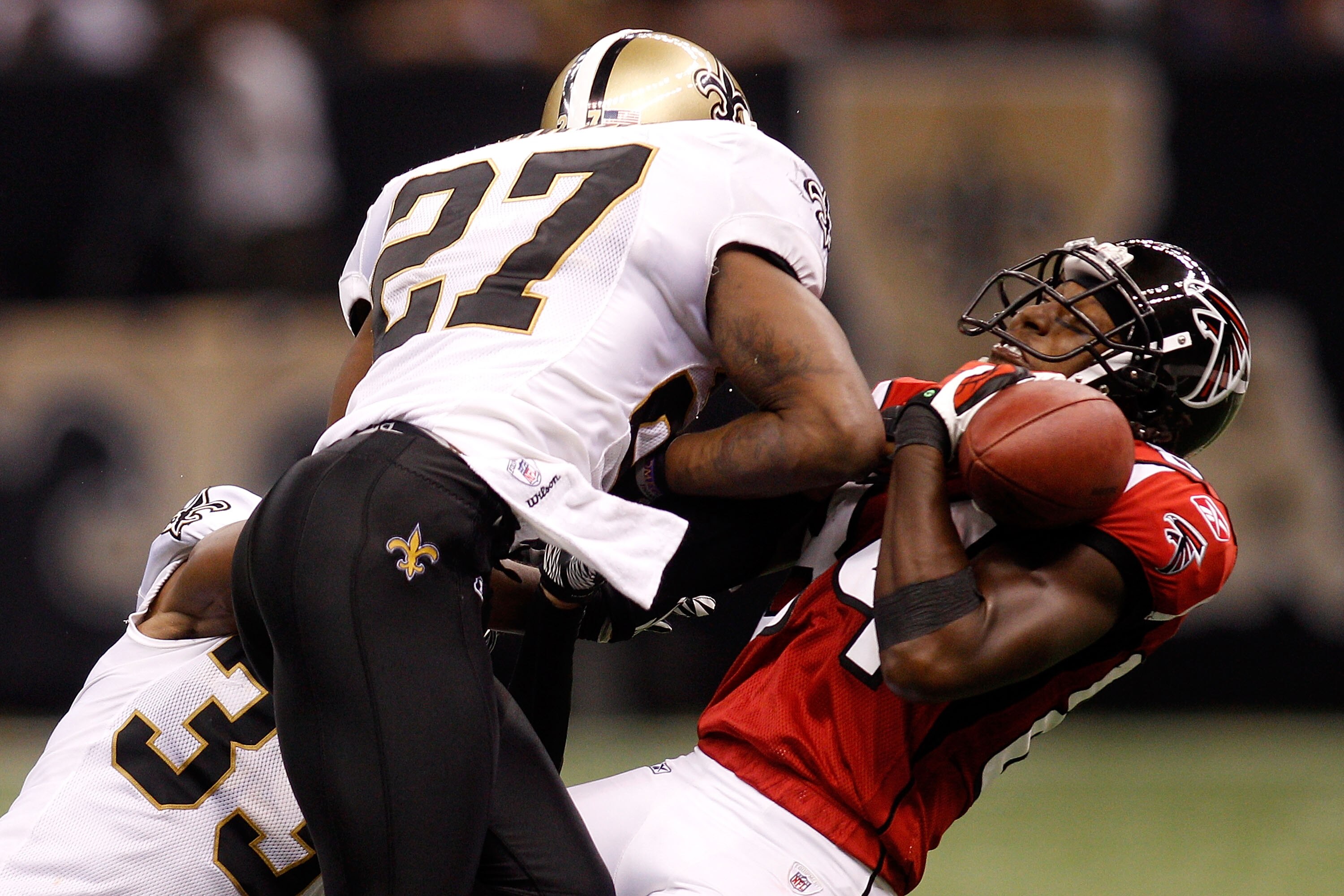 NEW ORLEANS - SEPTEMBER 26:  Roddy White #84 of the Atlanta Falcons is tackled by Malcom Jenkins #27 of the New Orleans Saints at the Louisiana Superdome on September 26, 2010 in New Orleans, Louisiana.  The Falcons defeated the Saints 27-24.  (Photo by C