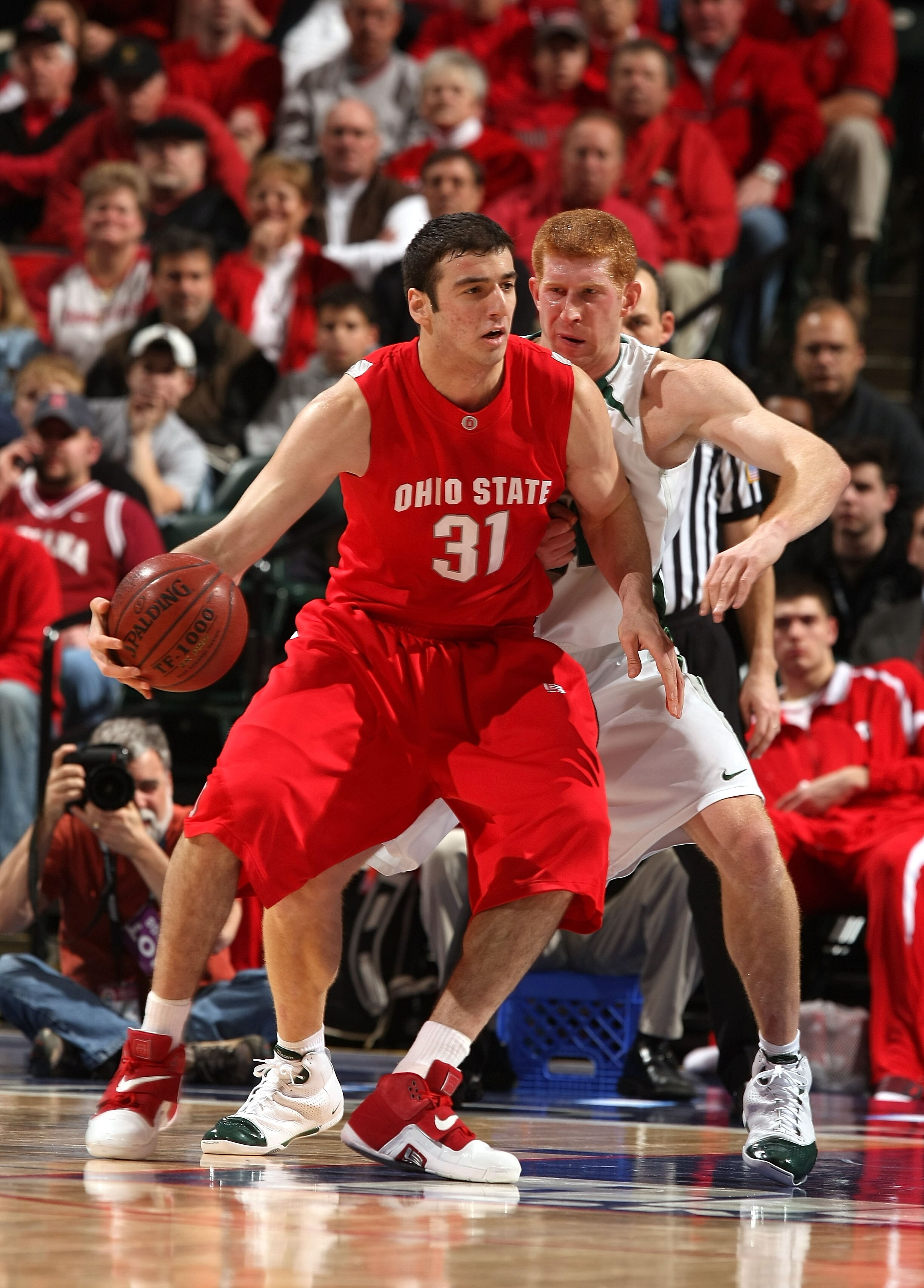 INDIANAPOLIS - MARCH 14:  Kosta Koufos #31 of the Ohio State Buckeyes posts up against Drew Naymick #34 of the Michigan State Spartans during the Big Ten Men's Basketball Tournament at Conseco Fieldhouse on March 14, 2008 in Indianapolis, Indiana.  (Photo