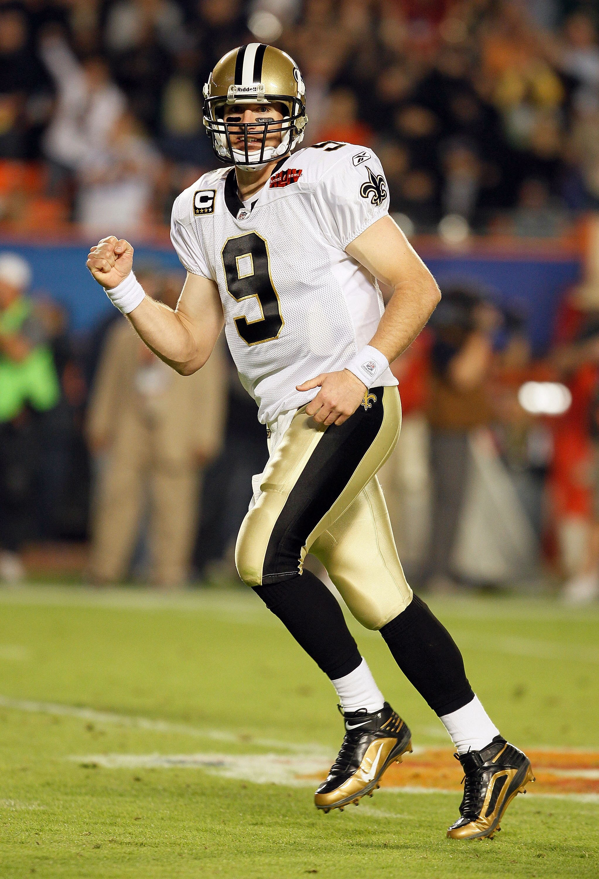 MIAMI GARDENS, FL - FEBRUARY 07:  Drew Brees #9 of the New Orleans Saints celebrates after a touchdown in the third quarter against the Indianapolis Colts during Super Bowl XLIV on February 7, 2010 at Sun Life Stadium in Miami Gardens, Florida.  (Photo by