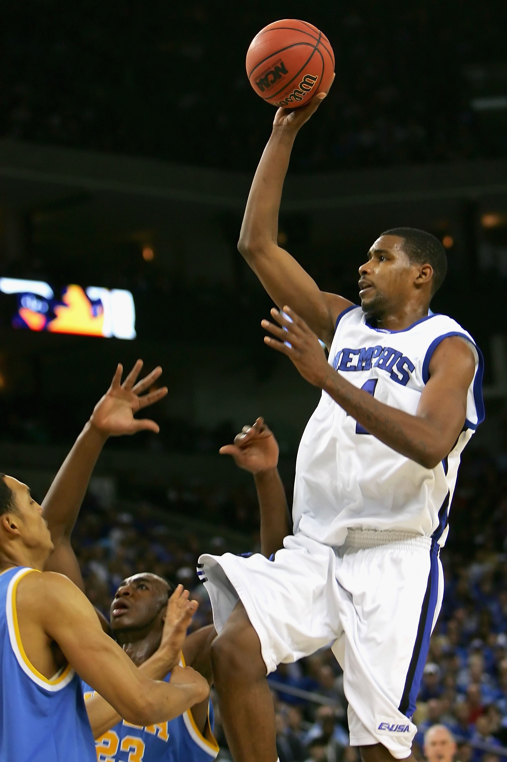 OAKLAND, CA - MARCH 25:  Shawne Williams #4 of the Memphis Tigers puts up a shot over the UCLA Bruins during the third round game of the NCAA Division I Men's Basketball Tournament at the Arena in Oakland on March 25, 2006 in Oakland, California.  (Photo 