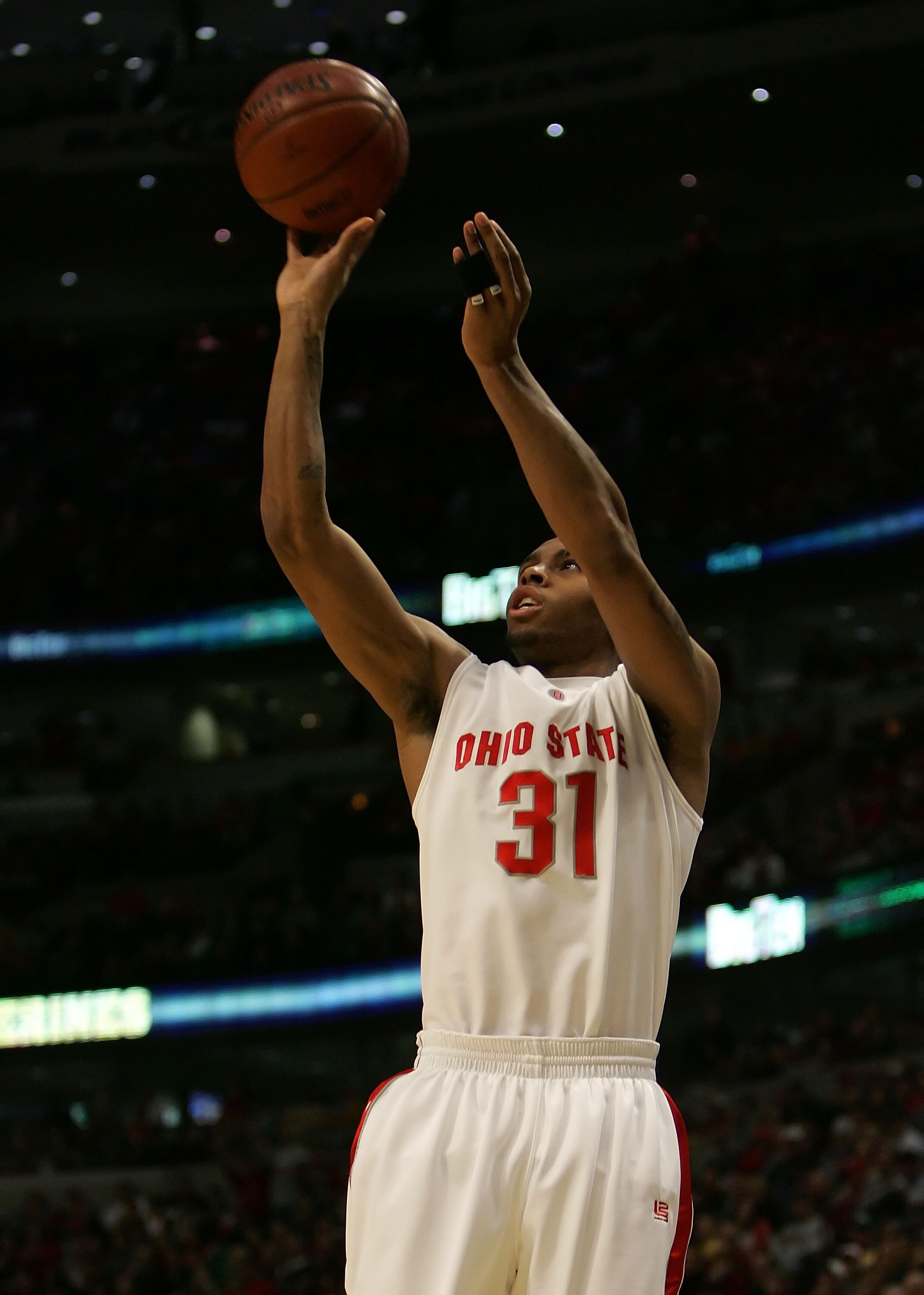 CHICAGO - MARCH 11:  Daequan Cook #31 of the Ohio State Buckeyes attempts a shot against the Wisconsin Badgers during the Final of the Big Ten Men's Basketball Conference Tournament March 11, 2007 at the United Center in Chiago Illinois. Ohio St. won 66-4