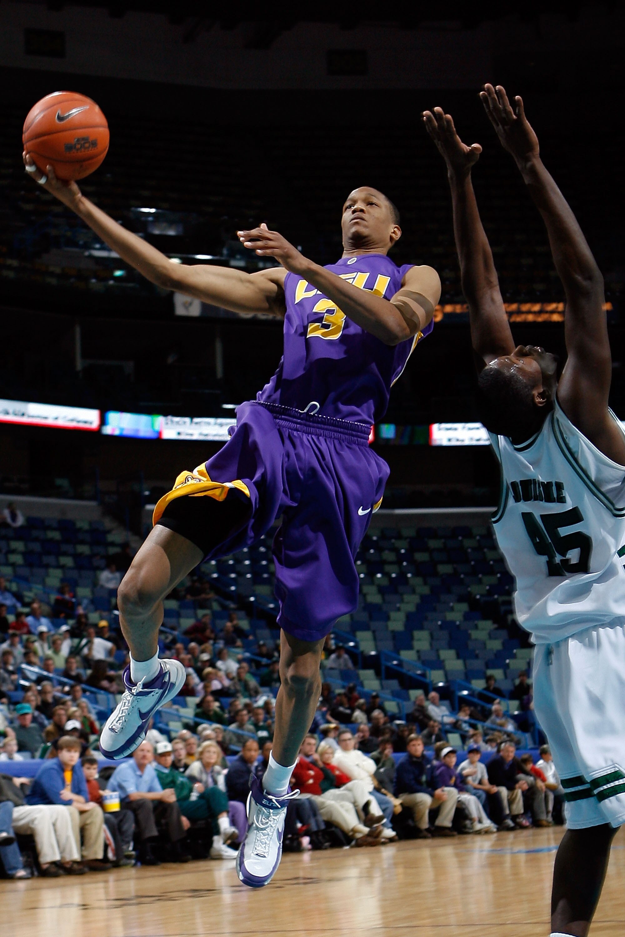 NEW ORLEANS - JANUARY 02:  Anthony Randolph #3 of the Louisiana State University Tigers makes a shot over Robinson Louisme #45 of the Tulane University Green Wave on January 2, 2008 at the New Orleans Arena in New Orleans, Louisiana.  Tulane defeated LSU 