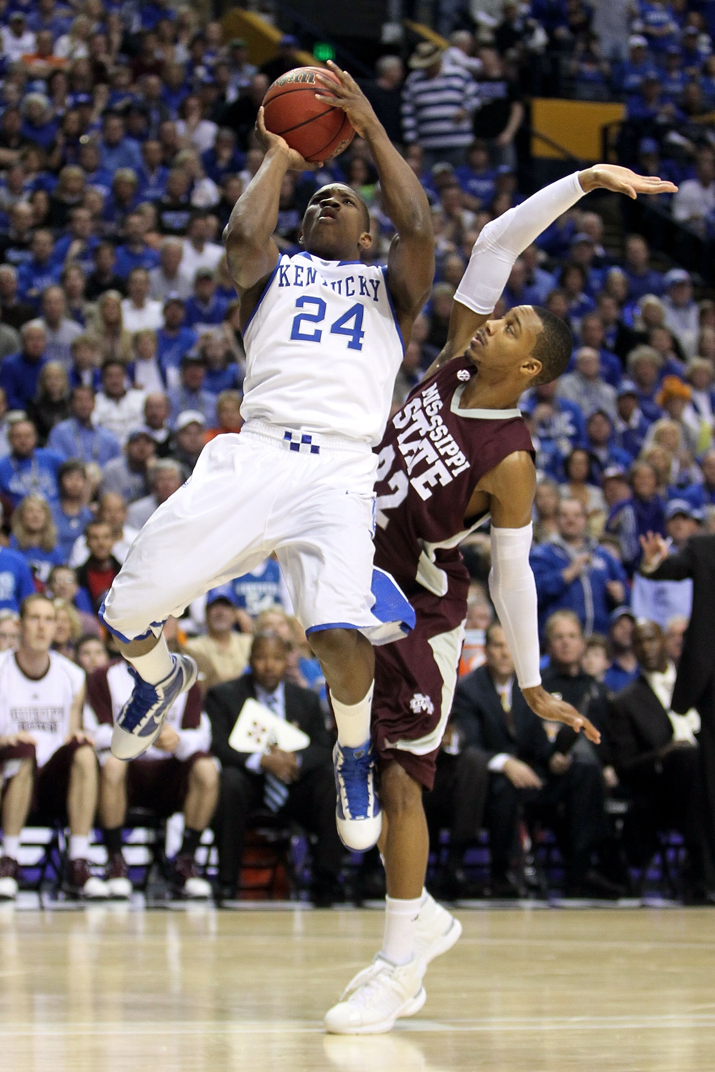 NASHVILLE, TN - MARCH 14:  Eric Bledsoe #24 of the Kentucky Wildcats drives for a shot attempt against Barry Stewart #22 of the Mississippi State Bulldogs during the final of the SEC Men's Basketball Tournament at the Bridgestone Arena on March 14, 2010 i