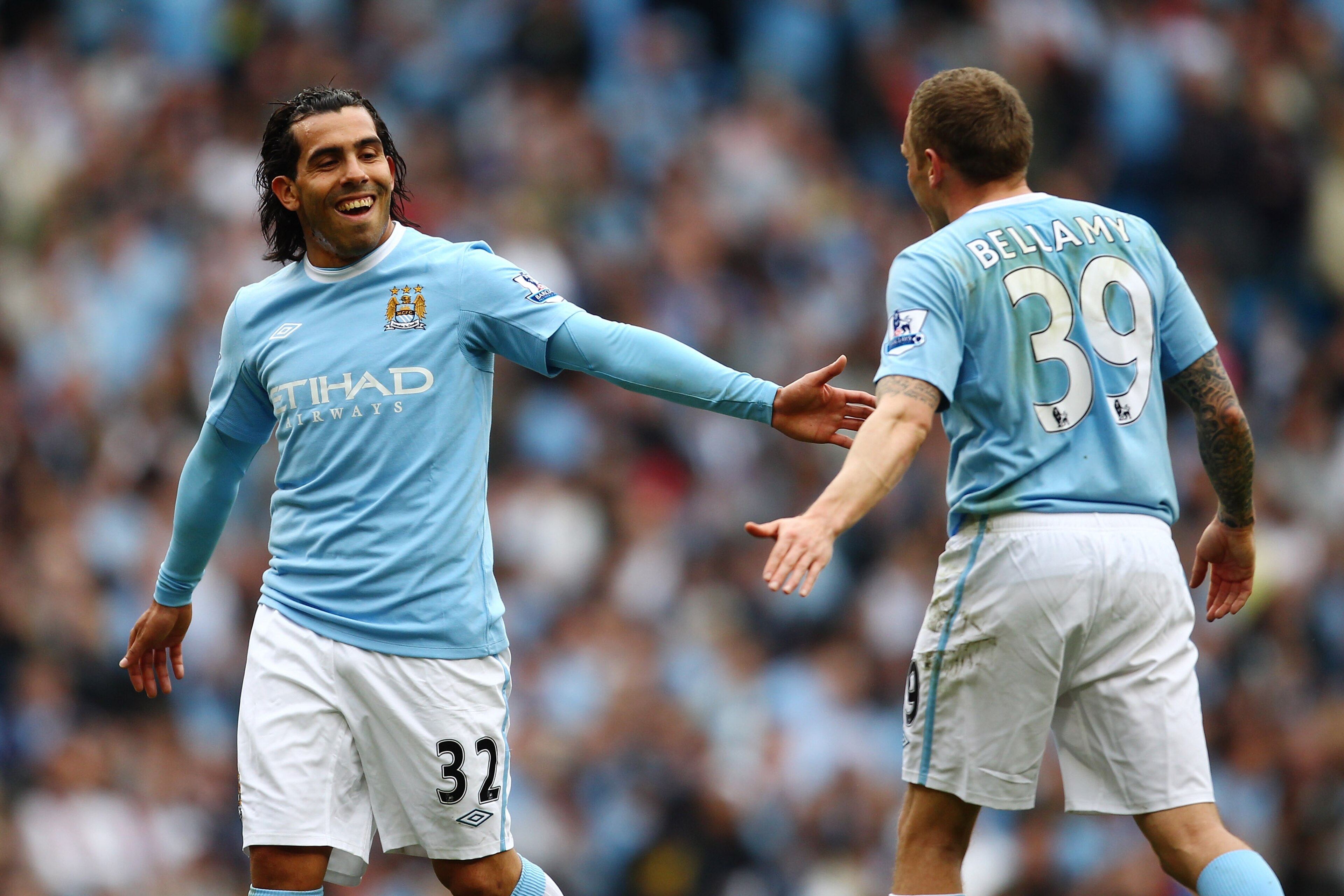 MANCHESTER, ENGLAND - APRIL 11: Carlos Tevez of Manchester City and Craig Bellamy smile during the Barclays Premier League match between Manchester City and Birmingham City at Eastlands, City of Manchester Stadium on April 11, 2010 in Manchester, England MANCHESTER, ENGLAND - APRIL 11: Carlos Tevez of Manchester City and Craig Bellamy smile during the Barclays Premier League match between Manchester City and Birmingham City at Eastlands, City of Manchester Stadium on April 11, 2010 in Manchester, England