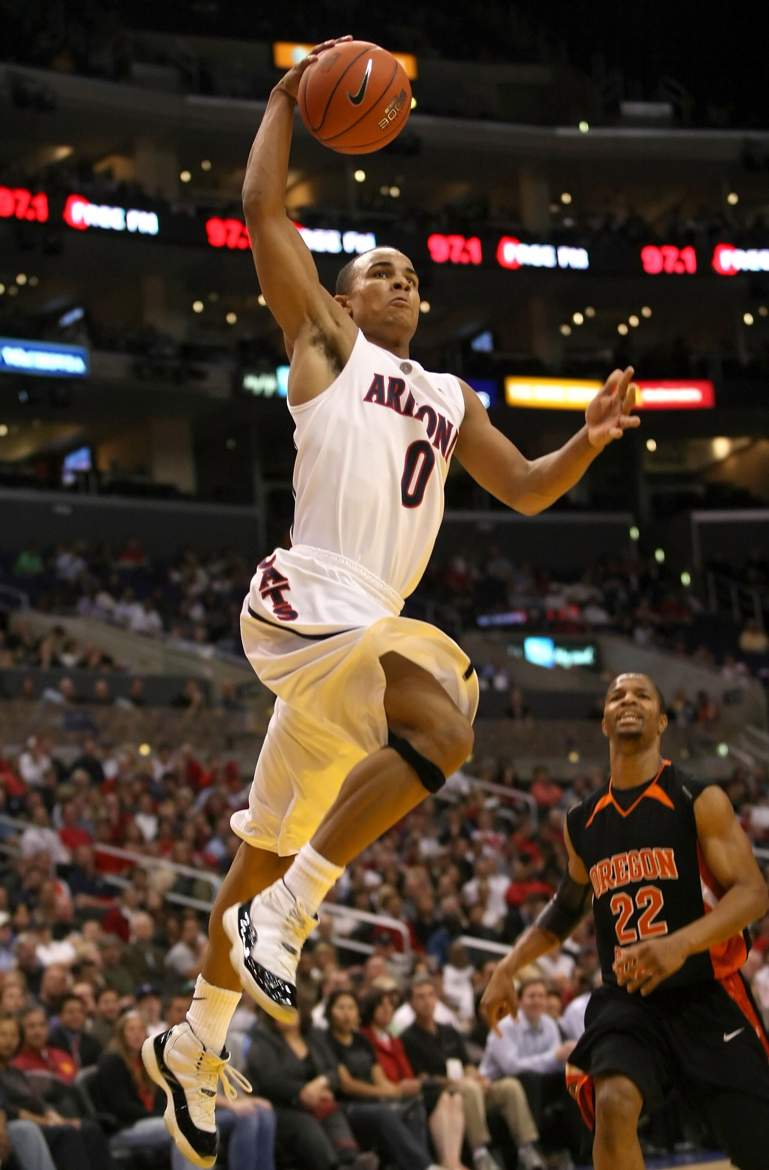 LOS ANGELES, CA - MARCH 12:  Jerryd Bayless #0 of the Arizona Wildcats dunks over the defense of Calvin Haynes #22 of the Oregon State Beavers during the 2008 Pacific Life Pac-10 Men's Basketball Tournament Day One at Staples Center on March 12, 2008 in L