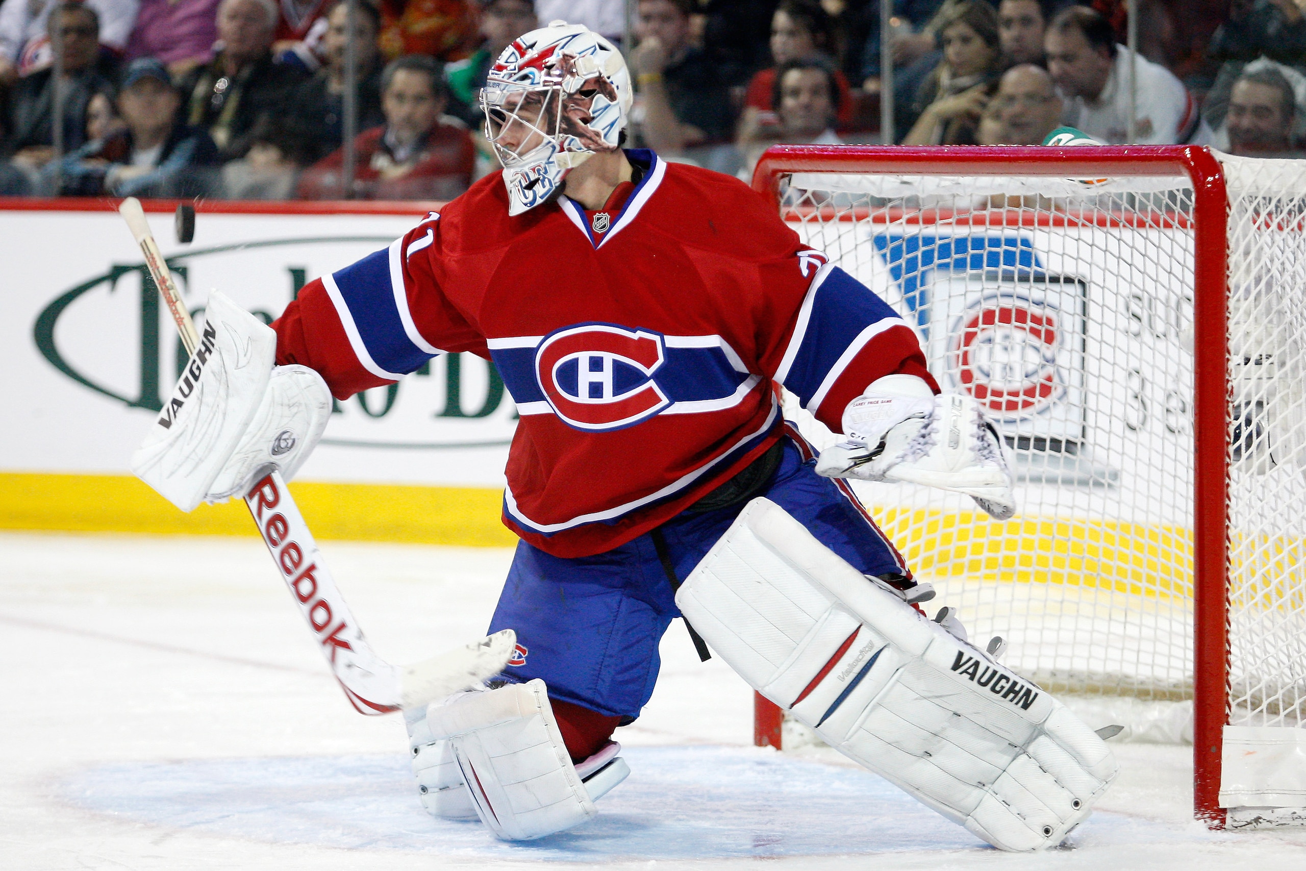 MONTREAL, CANADA - DECEMBER 16:  Carey Price #31 of the Montreal Canadiens makes a blocker save on the puck during the NHL game against the Boston Bruins at the Bell Centre on December 16, 2010 in Montreal, Quebec, Canada.  The Canadiens defeated the Brui