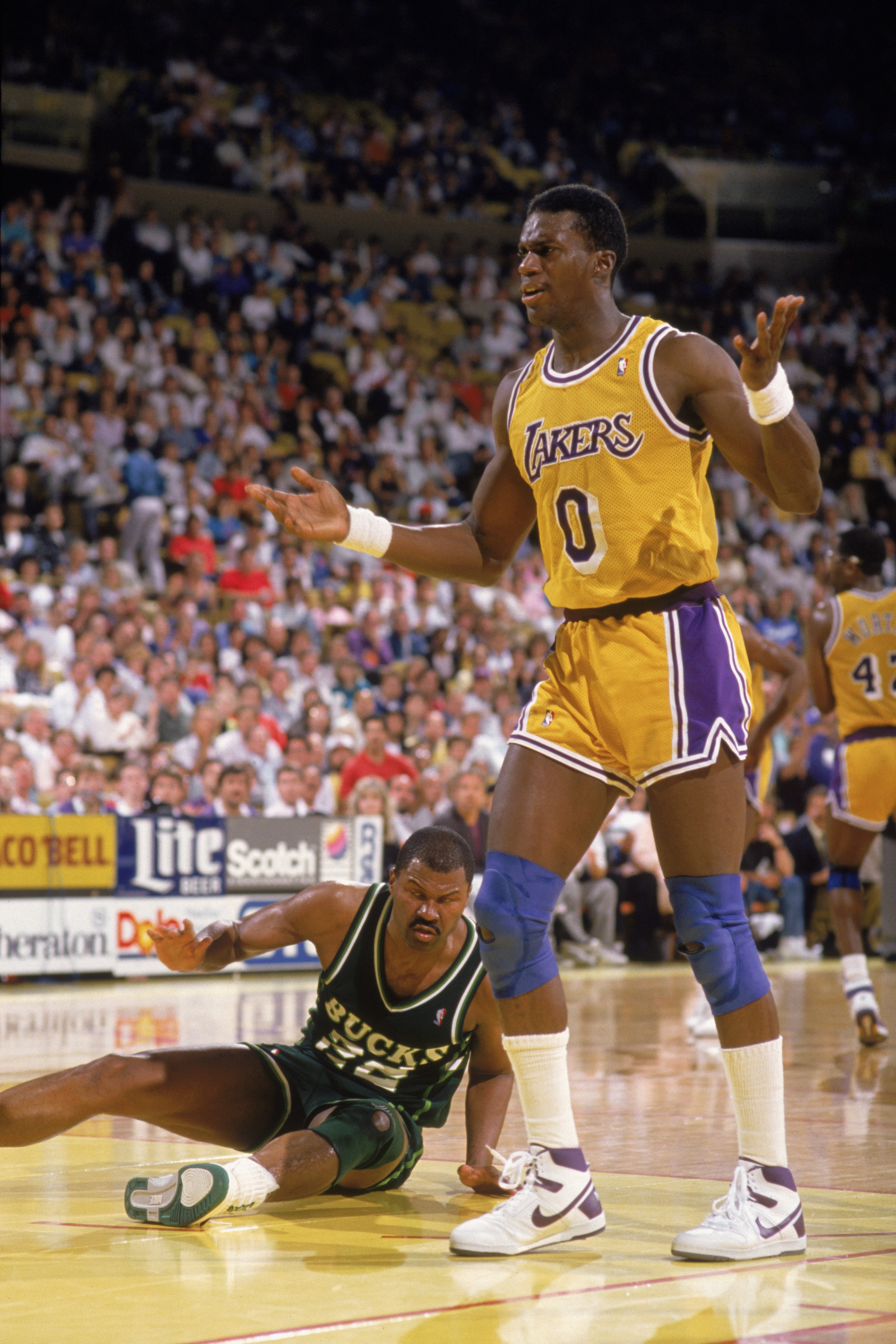 LOS ANGELES - 1988:  Orlando Woolridge #0 of the Los Angeles Lakers argues a call during an NBA game against the Milwaukee Bucks at the Great Western Forum in Los Angeles, California in 1988. (Photo by Tim Defrisco/Getty Images)