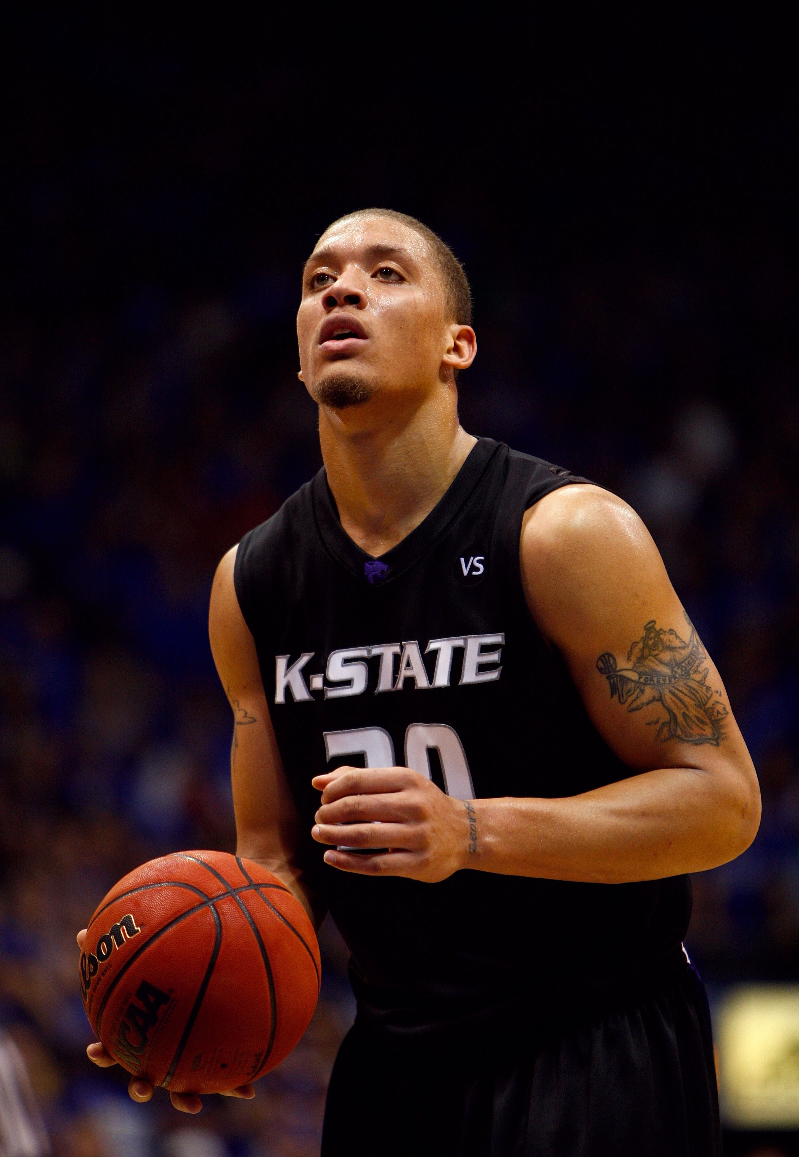 LAWRENCE, KS - MARCH 1:  Michael Beasley #30 of the Kansas State Wildcats sets up for a shot against the Kansas Jayhawks during their game on March 1, 2008 at Allen Fieldhouse in Lawrence, Kansas. The Jayhawks defeated the Wildcats 88-74. (Photo by Jamie 
