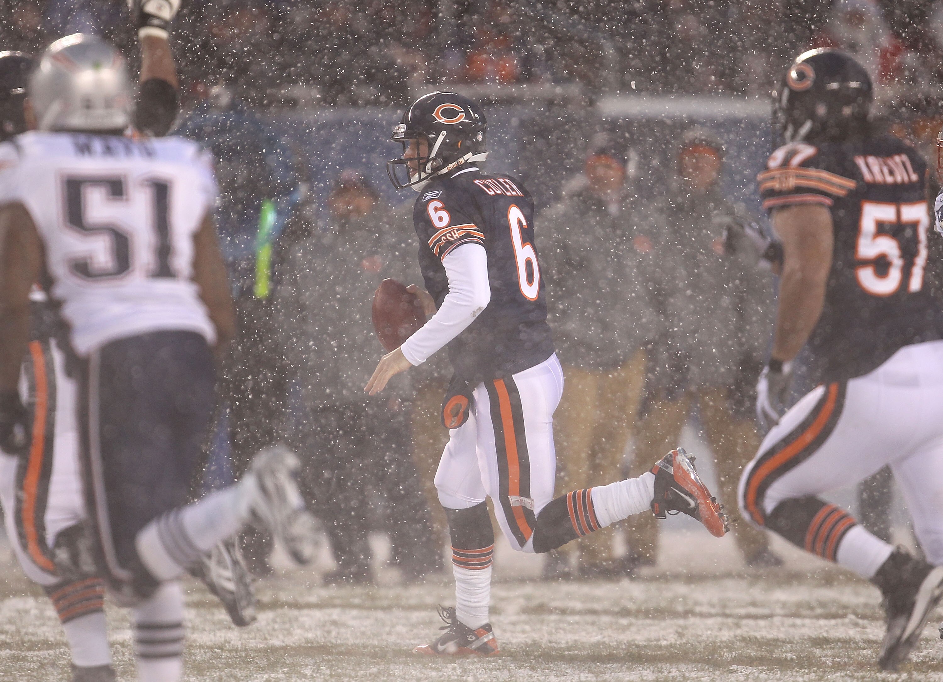 CHICAGO, IL - DECEMBER 12: Jay Cutler #6 of the Chicago Bearsruns for a first down against the New England Patriots at Soldier Field on December 12, 2010 in Chicago, Illinois. The Patriots defeated the Bears 36-7. (Photo by Jonathan Daniel/Getty Images)