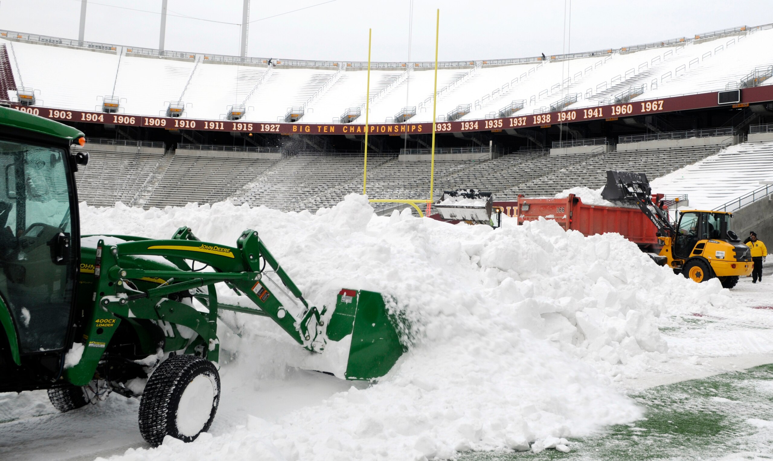 MINNEAPOLIS, MN - DECEMBER 15: Heavy machinery removes snow from the field as TCF Bank Stadium prepares for a potential monday night football game between the Minnesota Vikings and Chicago Bears on December 15, 2010 in Minneapolis, Minnesota. Preparations