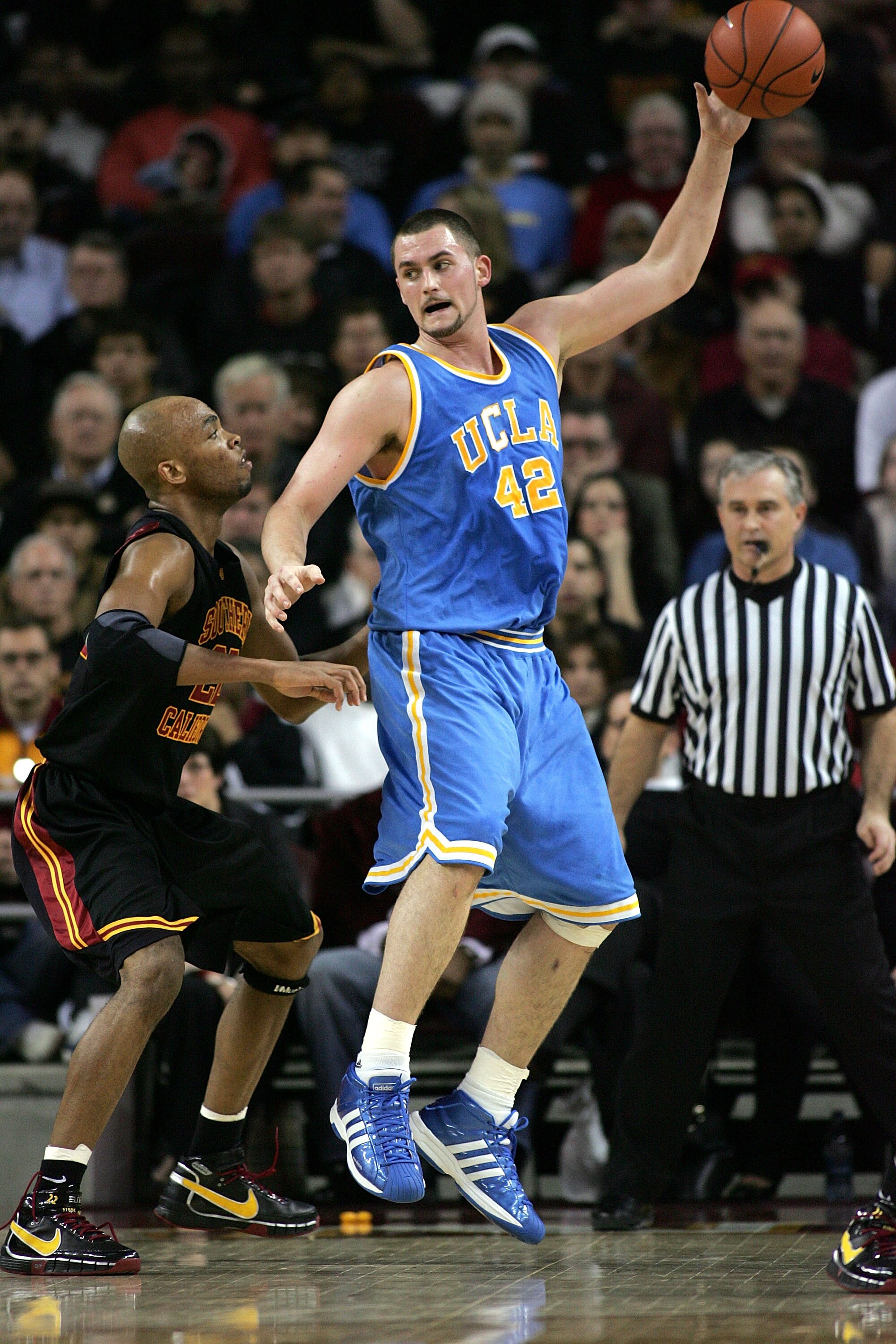 LOS ANGELES, CA - FEBRUARY 17:  Kevin Love #42 of the UCLA Bruins gets the ball in the low post against Taj Gibson #22 of the USC Trojans in the first half during their Pac-10 Conference game at the Galen Center on February 17, 2008 in Los Angeles, Califo