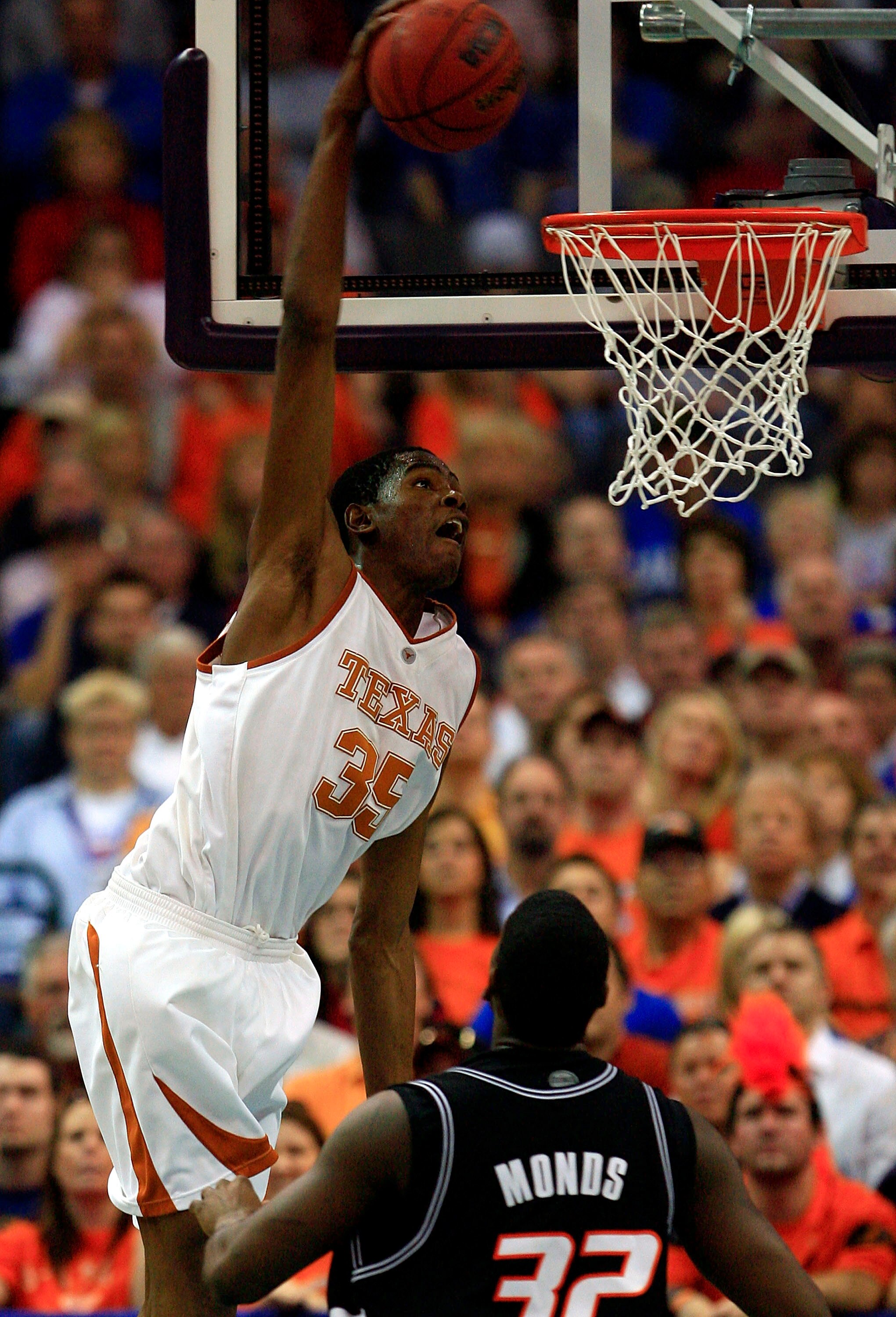 OKLAHOMA CITY - MARCH 10:  Kevin Durant #35 of the Texas Longhorns dunks over David Monds #32 of the Oklahoma State Cowboys during the semifinal game of the Phillips 66 Big 12 Men's Basketball Championship on March 10, 2007 at the Ford Center in Oklahoma 