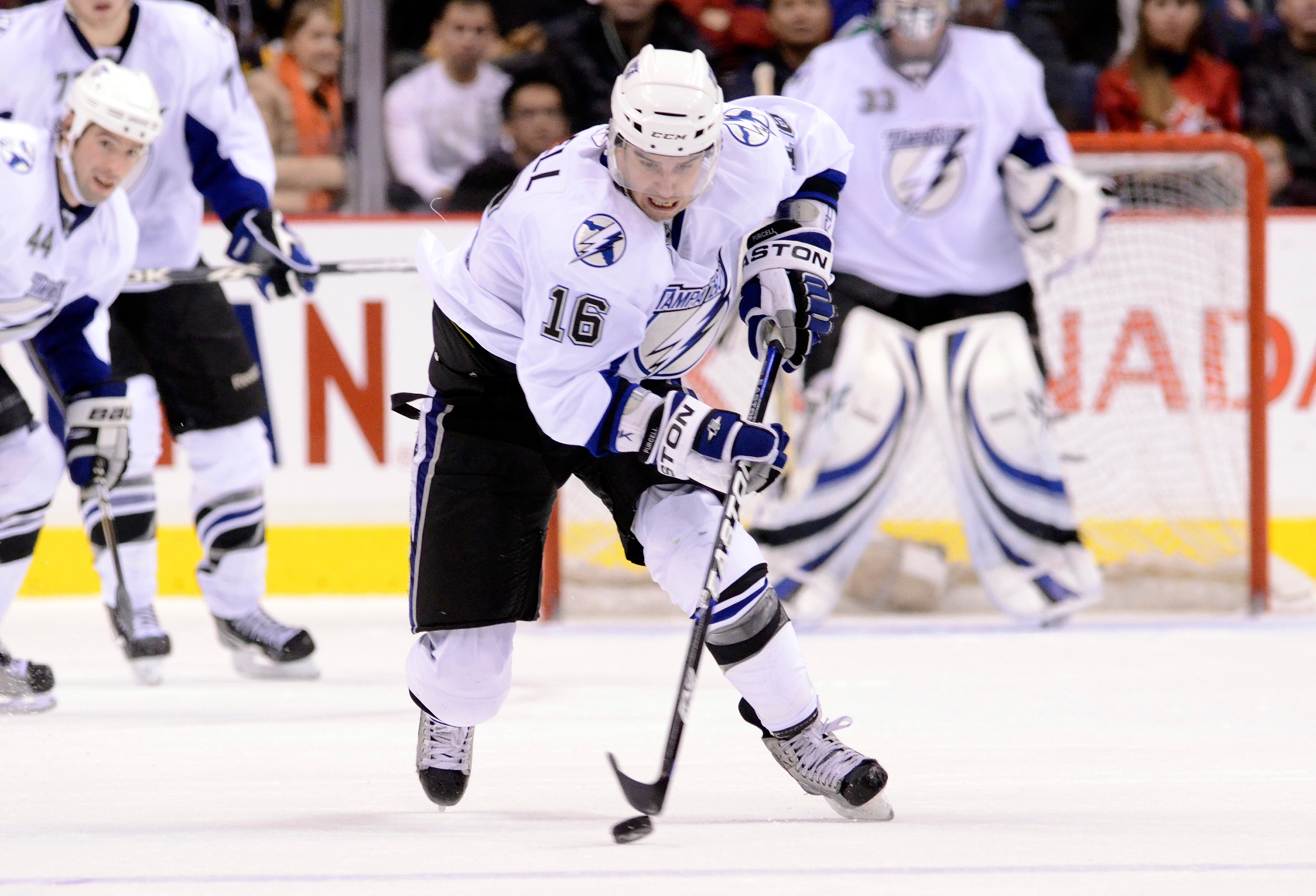 VANCOUVER, CANADA - DECEMBER 11: Teddy Purcell #16 of the Tampa Bay Lightning skates with the puck during NHL action on December 11, 2010 against the Vancouver Canucks at Rogers Arena in Vancouver, BC, Canada.  (Photo by Rich Lam/Getty Images)