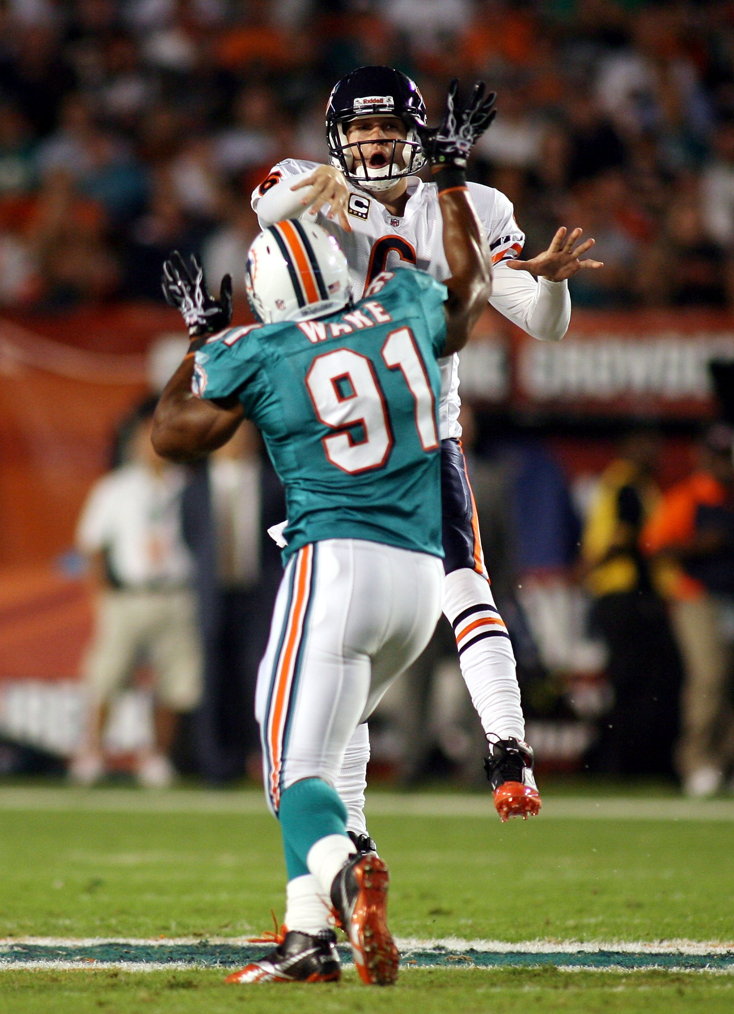 MIAMI - NOVEMBER 18: Quarterback Jay Cutler #6 of the Chicago Bears is preasured by linebacker Cameron wake #91 of the Miami Dolphins at Sun Life Stadium on November 18, 2010 in Miami, Florida. (Photo by Marc Serota/Getty Images) MIAMI - NOVEMBER 18: Quarterback Jay Cutler #6 of the Chicago Bears is preasured by linebacker Cameron wake #91 of the Miami Dolphins at Sun Life Stadium on November 18, 2010 in Miami, Florida. (Photo by Marc Serota/Getty Images)