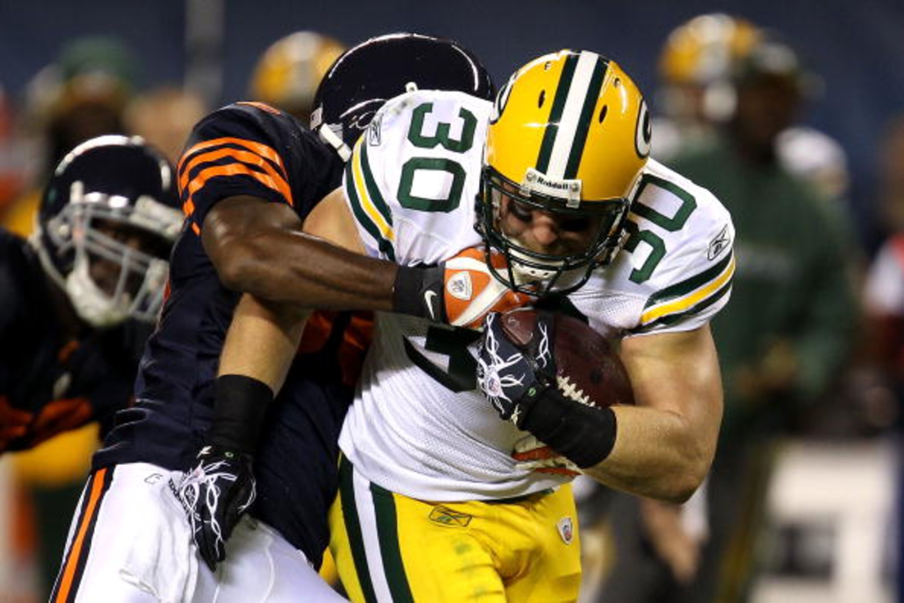CHICAGO - SEPTEMBER 27: John Kuhn #30 of the Green Bay Packers runs the ball against the Chicago Bears at Soldier Field on September 27, 2010 in Chicago, Illinois. The Bears won 20-17. (Photo by Jonathan Daniel/Getty Images) CHICAGO - SEPTEMBER 27: John Kuhn #30 of the Green Bay Packers runs the ball against the Chicago Bears at Soldier Field on September 27, 2010 in Chicago, Illinois. The Bears won 20-17. (Photo by Jonathan Daniel/Getty Images)