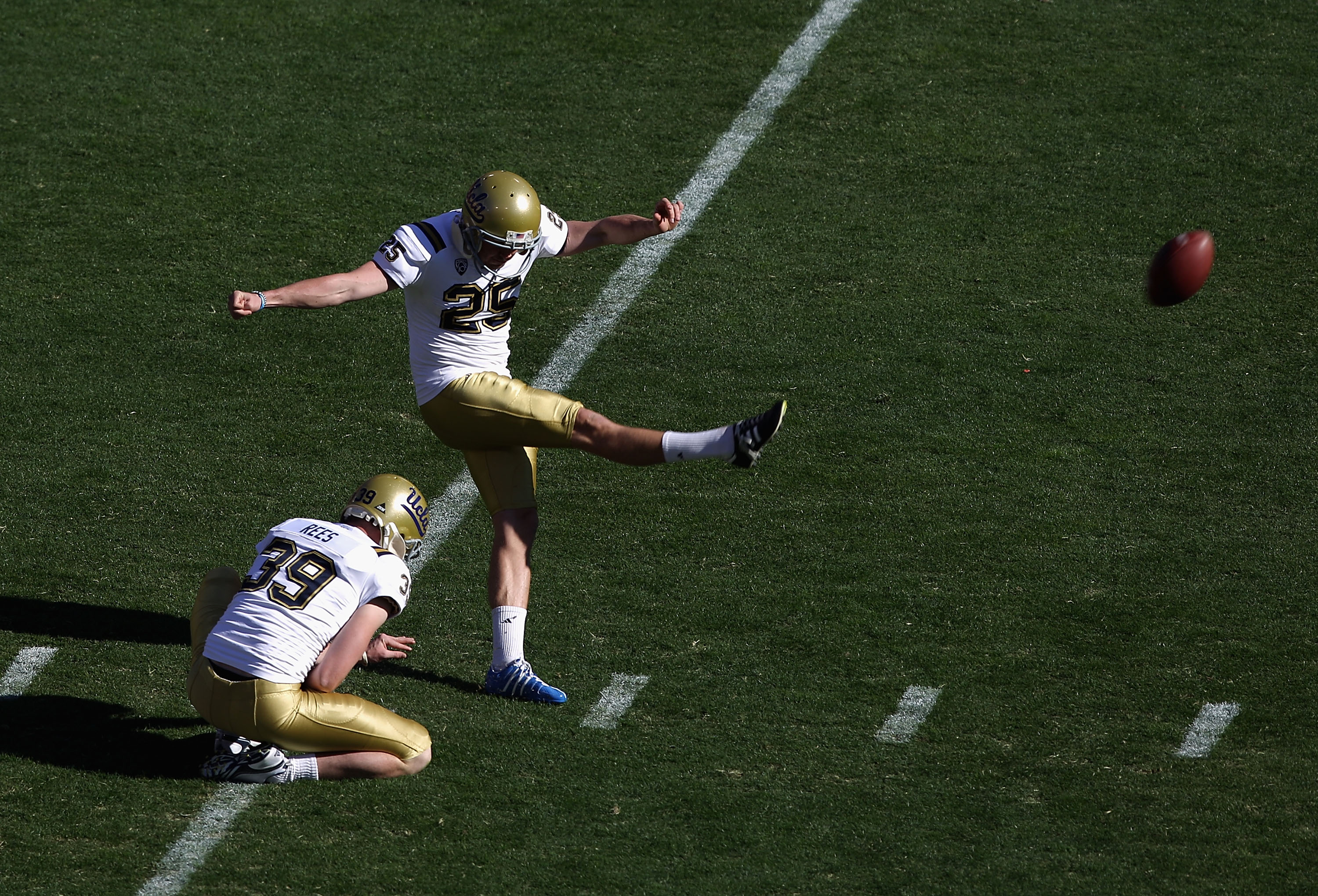 TEMPE, AZ - NOVEMBER 26:  Kicker Kai Forbath #25 of the UCLA Bruins kicks the football during the college football game against the Arizona State Sun Devils at Sun Devil Stadium on November 26, 2010 in Tempe, Arizona. . The Sun Devils defeated the Bruins