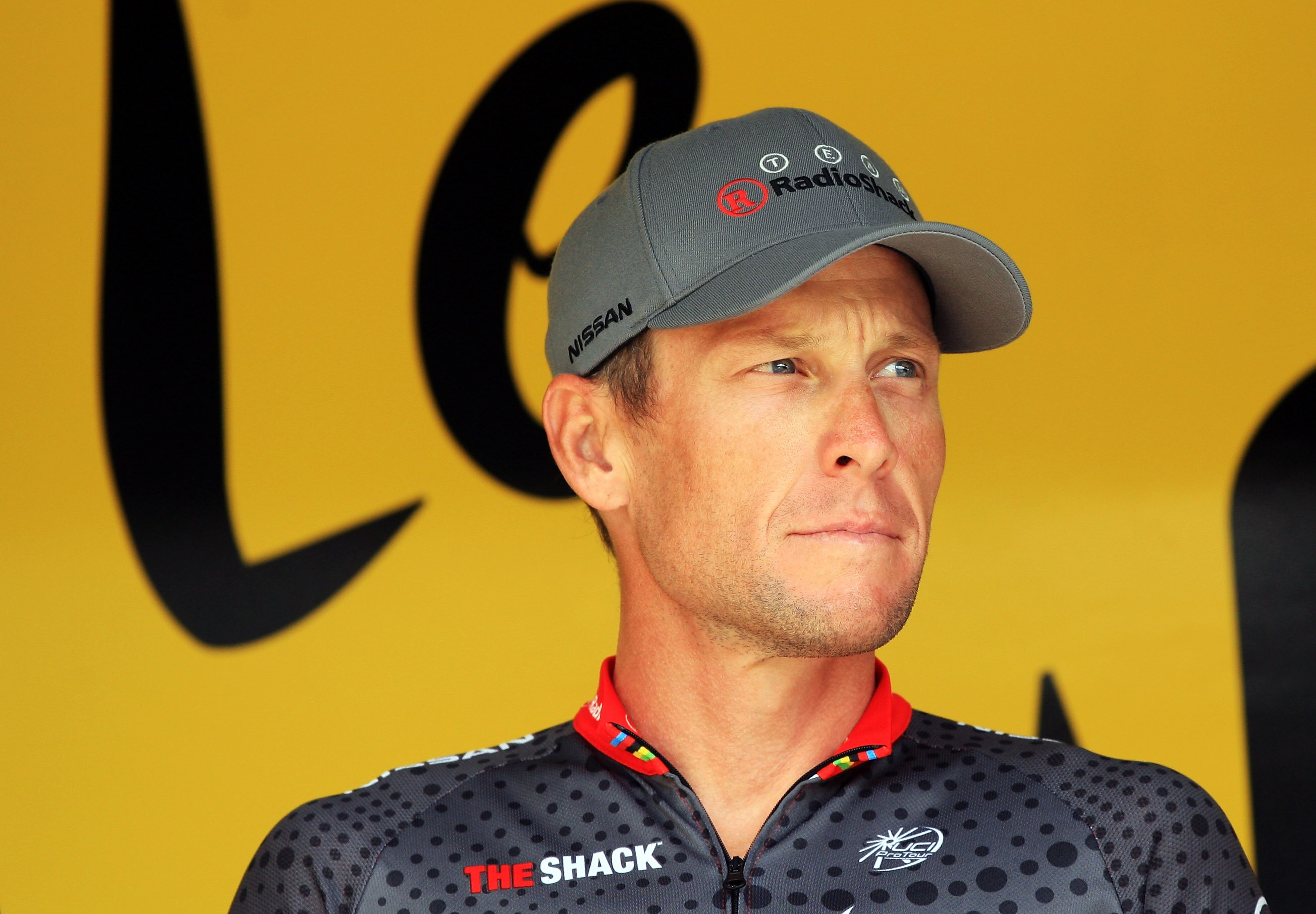 RODEZ, FRANCE - JULY 17:  Lance Armstrong of the USA and Team Radioshack signs on at the start of stage thirteen of the 2010 Tour de France from Rodez to Revel on July 17, 2010 in Revel, France.  (Photo by Bryn Lennon/Getty Images)