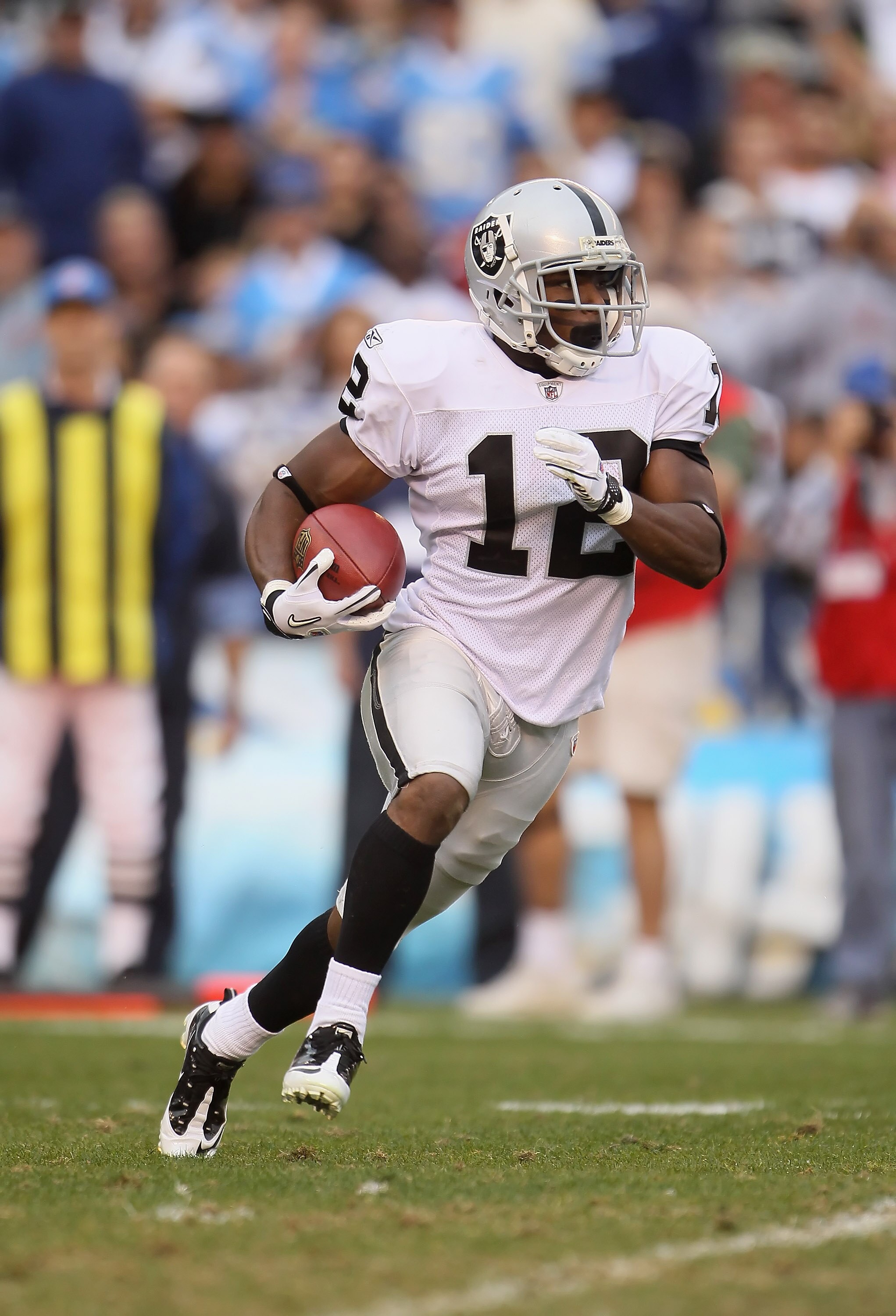 SAN DIEGO - DECEMBER 05:  Jacoby Ford #12 the Oakland Raiders carries the ball against the San Diego Chargers at Qualcomm Stadium on December 5, 2010 in San Diego, California. The Raiders defeated the Chargers 28-13.  (Photo by Jeff Gross/Getty Images)