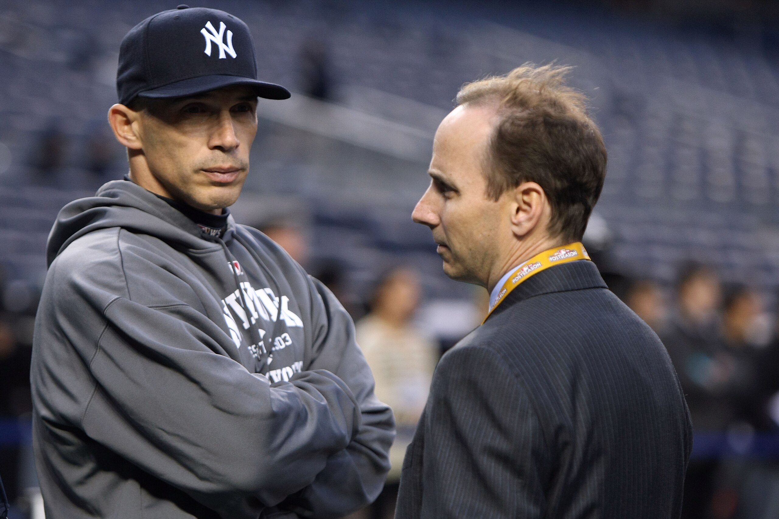 NEW YORK - OCTOBER 28:  Manager Joe Girardi (L) and General Manager Brian Cashman of the New York Yankees look on during batting practice against the Philadelphia Phillies in Game One of the 2009 MLB World Series at Yankee Stadium on October 28, 2009 in t