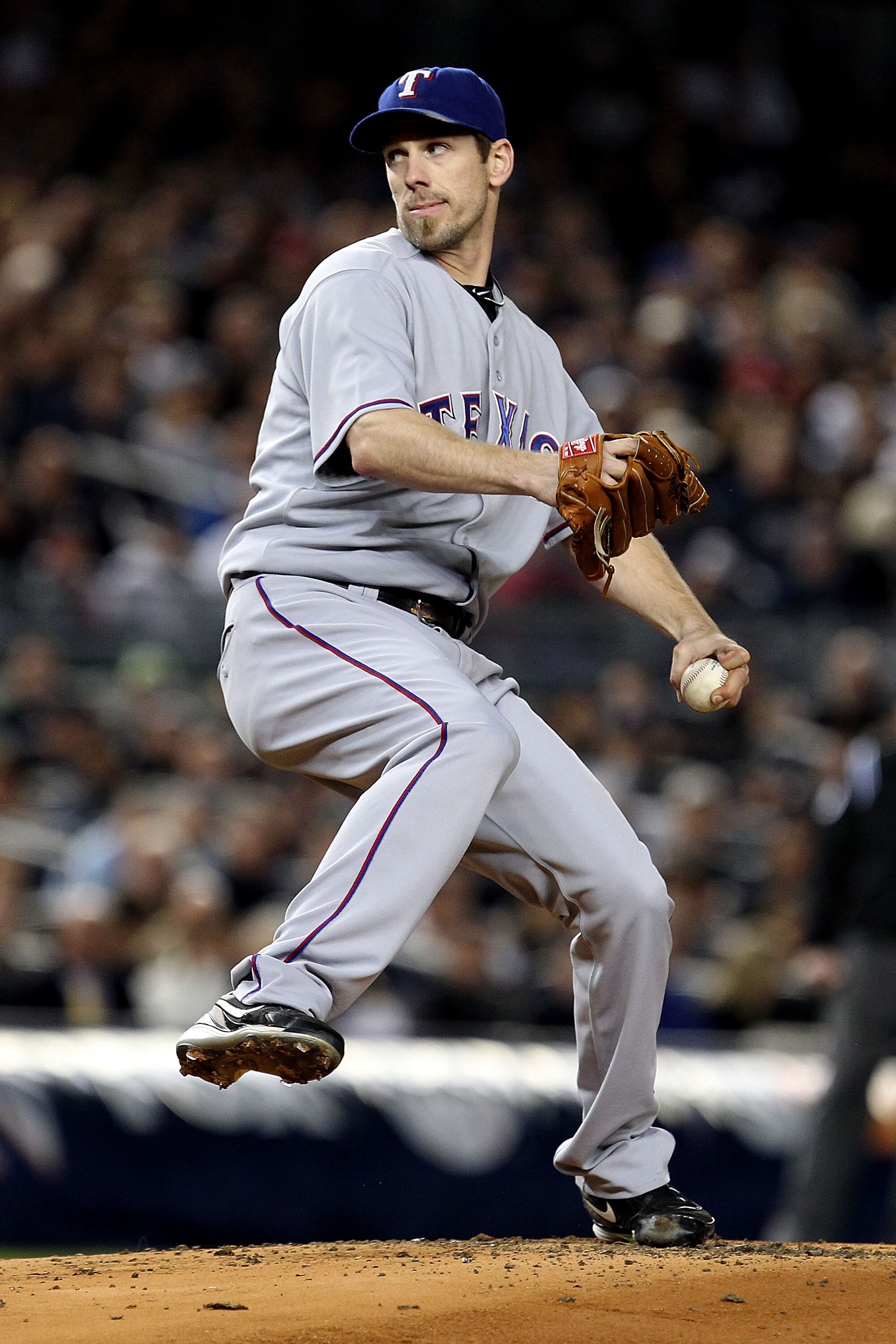 NEW YORK - OCTOBER 18:  Cliff Lee #33 of the Texas Rangers throws a pitch against the New York Yankees in Game Three of the ALCS during the 2010 MLB Playoffs at Yankee Stadium on October 18, 2010 in New York, New York. The Rangers won 8-0.  (Photo by Al B