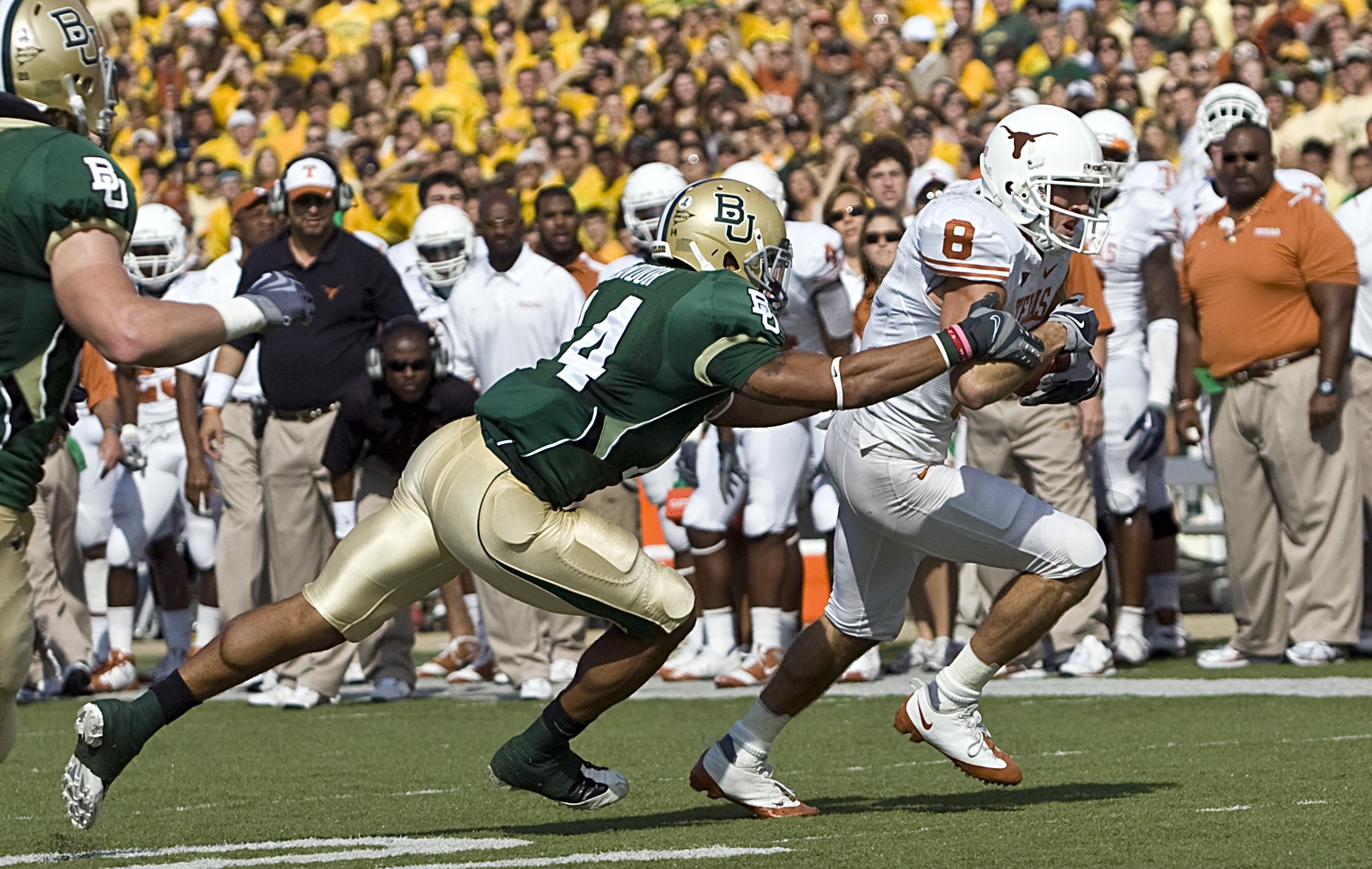 WACO, TX - NOVEMBER 14:  Wide receiver Jordan Shipley #8 of the Texas Longhorns carries the ball against safety Byron Landor #14 of the Baylor Bears in the first half on November 14, 2009 at Floyd Casey Stadium in Waco, Texas.  The Longhorns beat the Bear