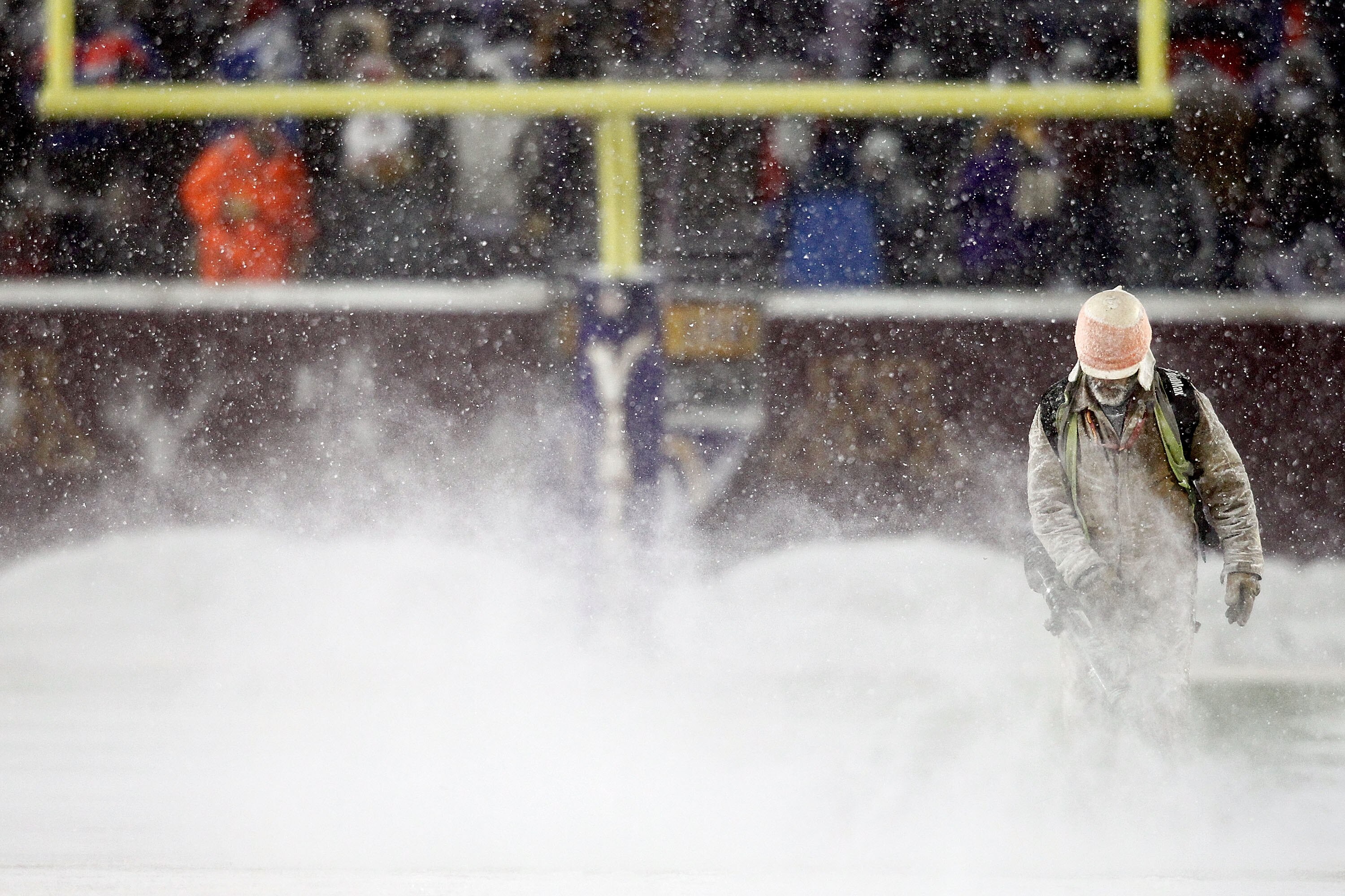 MINNEAPOLIS, MN - DECEMBER 20:  Workers clear snow from the field before Minnesota Vikings play the Chicago Bears at TCF Bank Stadium on December 20, 2010 in Minneapolis, Minnesota.  (Photo by Matthew Stockman/Getty Images)