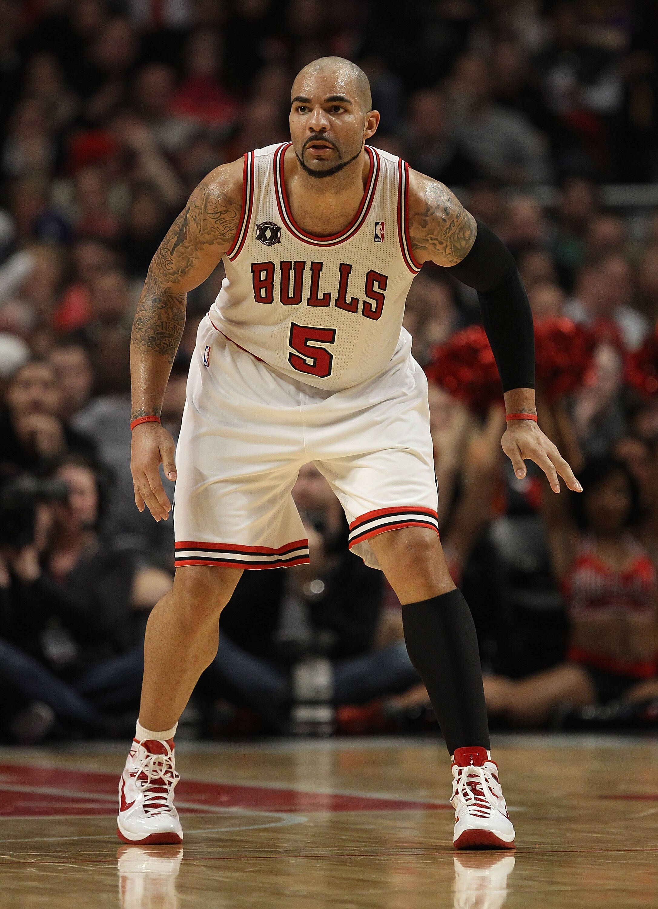 CHICAGO, IL - DECEMBER 10: Carlos Boozer #5 of the Chicago Bulls sets to defend against the Los Angeles Lakers at the United Center on December 10, 2010 in Chicago, Illinois. The Bulls defeated the Lakers 88-84. NOTE TO USER: User expressly acknowledges a