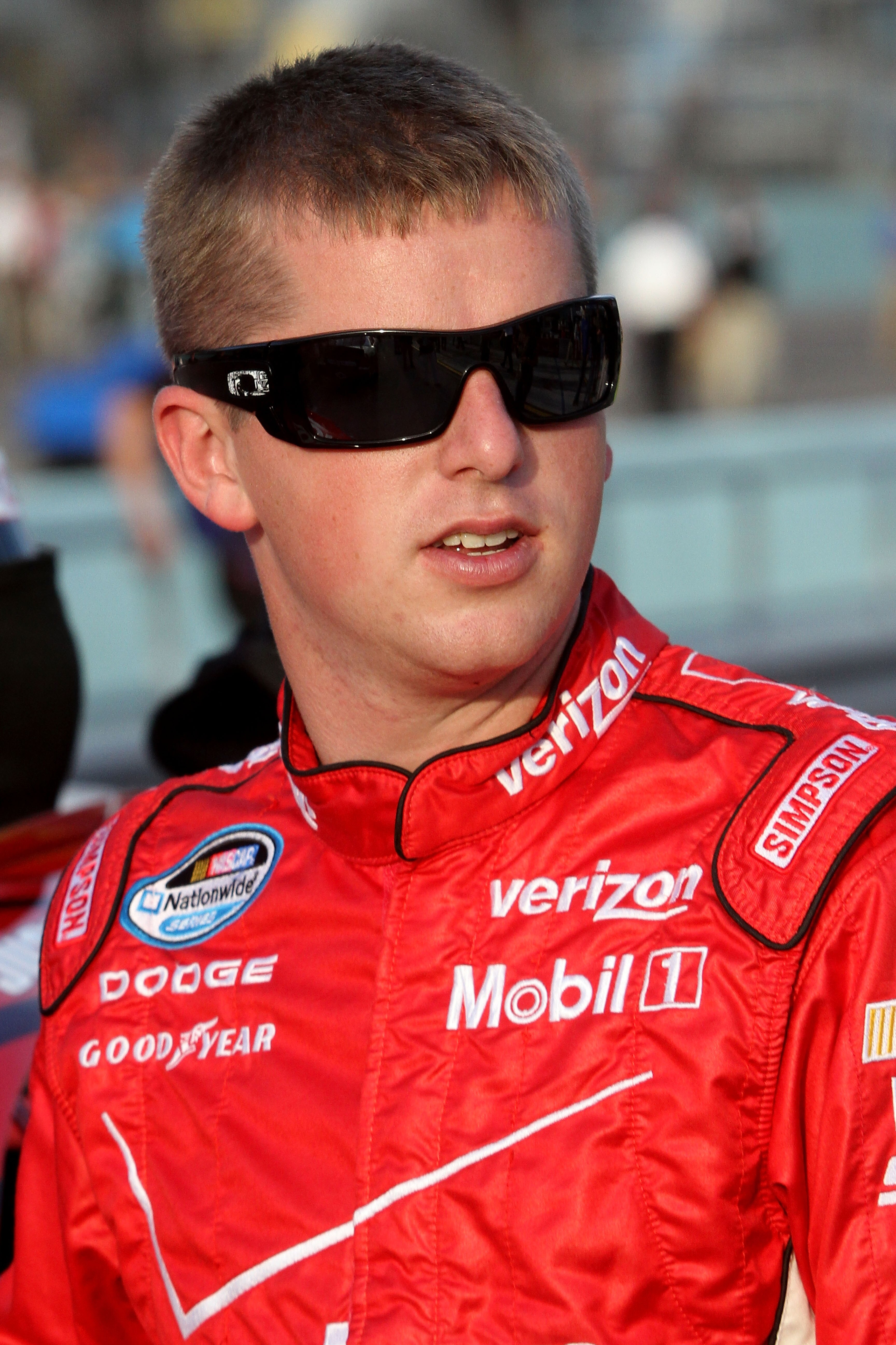 HOMESTEAD, FL - NOVEMBER 20:  Justin Allgaier, driver of the #12 Verizon Wireless Dodge, stands on the grid prior to the NASCAR Nationwide Series Ford 300 at Homestead-Miami Speedway on November 20, 2010 in Homestead, Florida.  (Photo by Jerry Markland/Ge