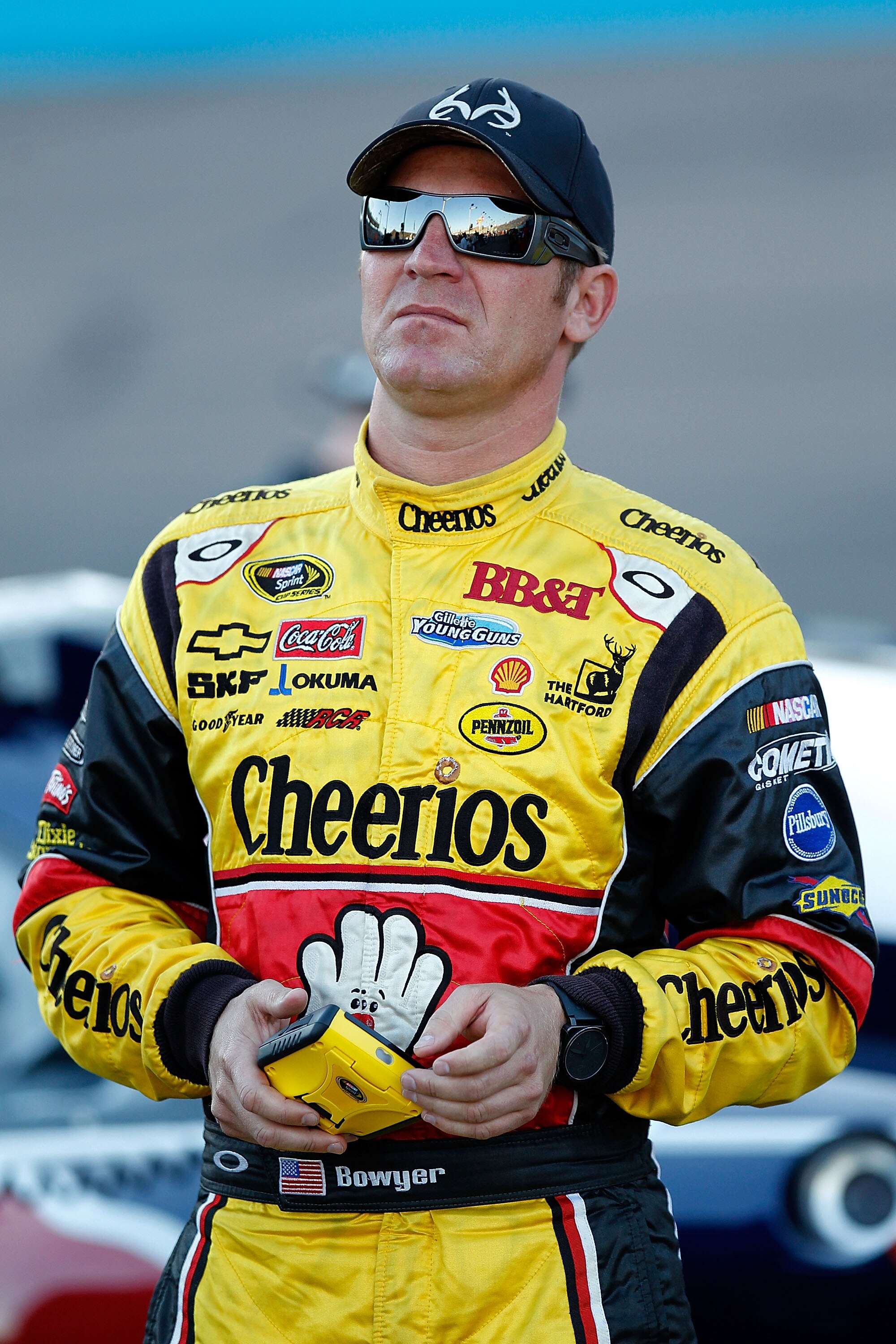 AVONDALE, AZ - NOVEMBER 12: Clint Bowyer, driver of the #33 Cheerios/Hamburger Helper Chevrolet, stands on pit road during qualifying for the NASCAR Sprint Cup Series Kobalt Tools 500 at Phoenix International Raceway on November 12, 2010 in Avondale, Ariz