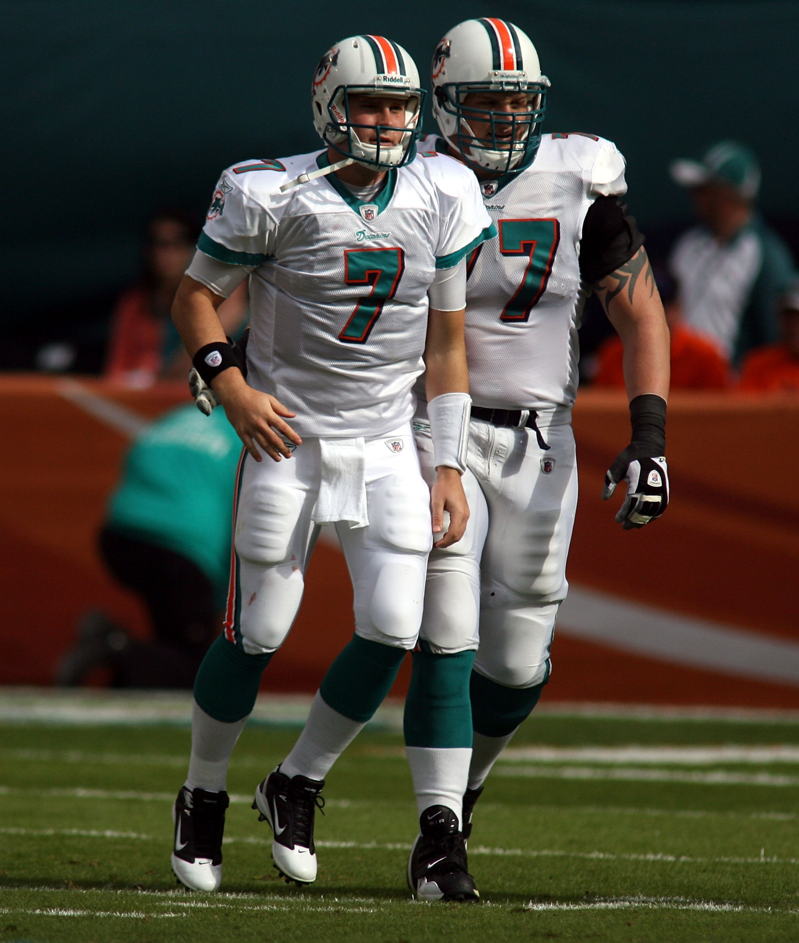 MIAMI - DECEMBER 19:  Quarterback Chad Henne #7 and Lineman Jake Long#77 of the Miami Dolphins throws against the Buffalo Bills at Sun Life Stadium on December 19, 2010 in Miami, Florida. The Bills defeated the Dolphins 17-14.  (Photo by Marc Serota/Getty
