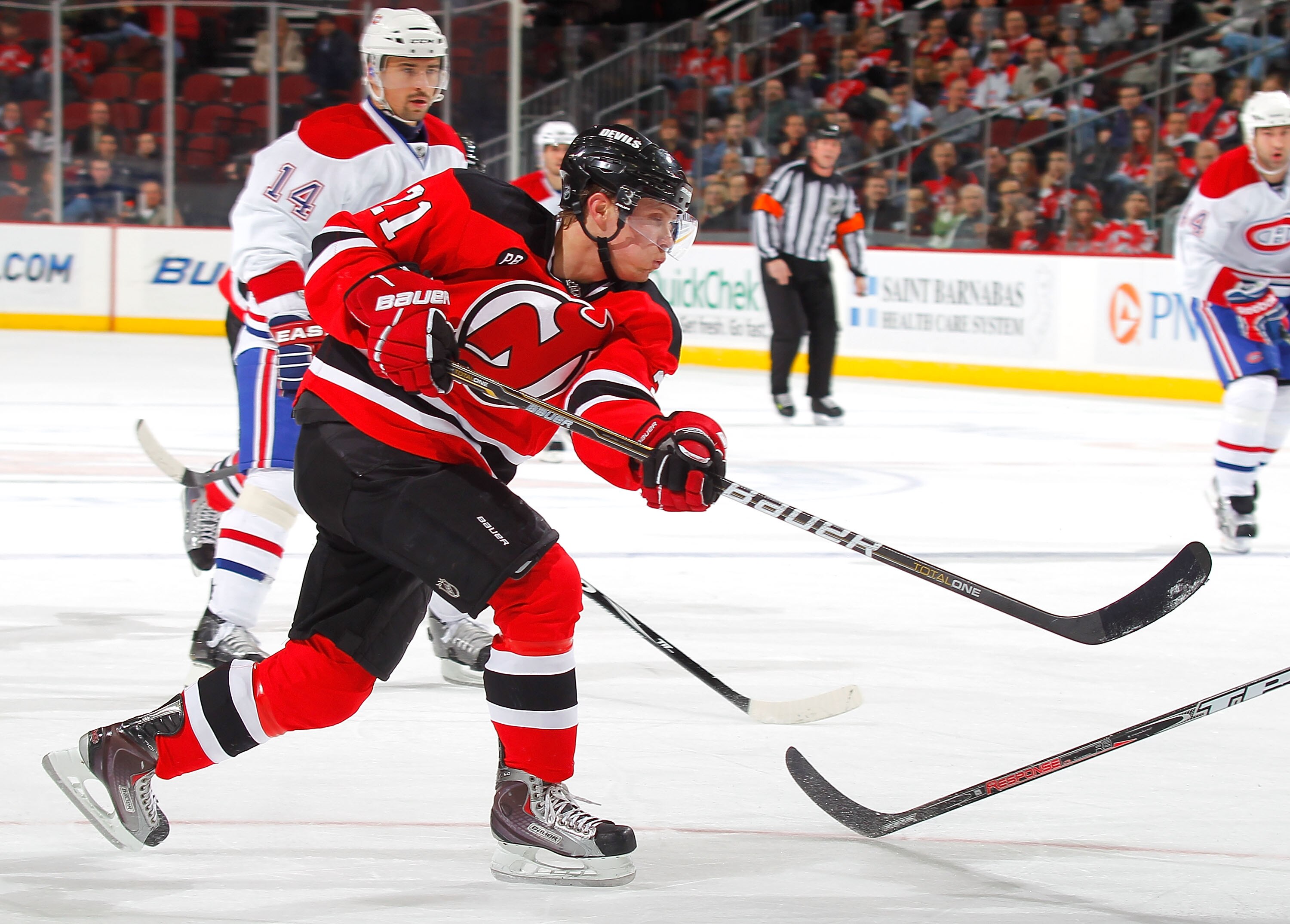 NEWARK, NJ - DECEMBER 02:  Mattias Tedenby #21 of the New Jersey Devils shoots during a hockey game against the Montreal Canadiens at the Prudential Center on December 2, 2010 in Newark, New Jersey.  (Photo by Paul Bereswill/Getty Images)