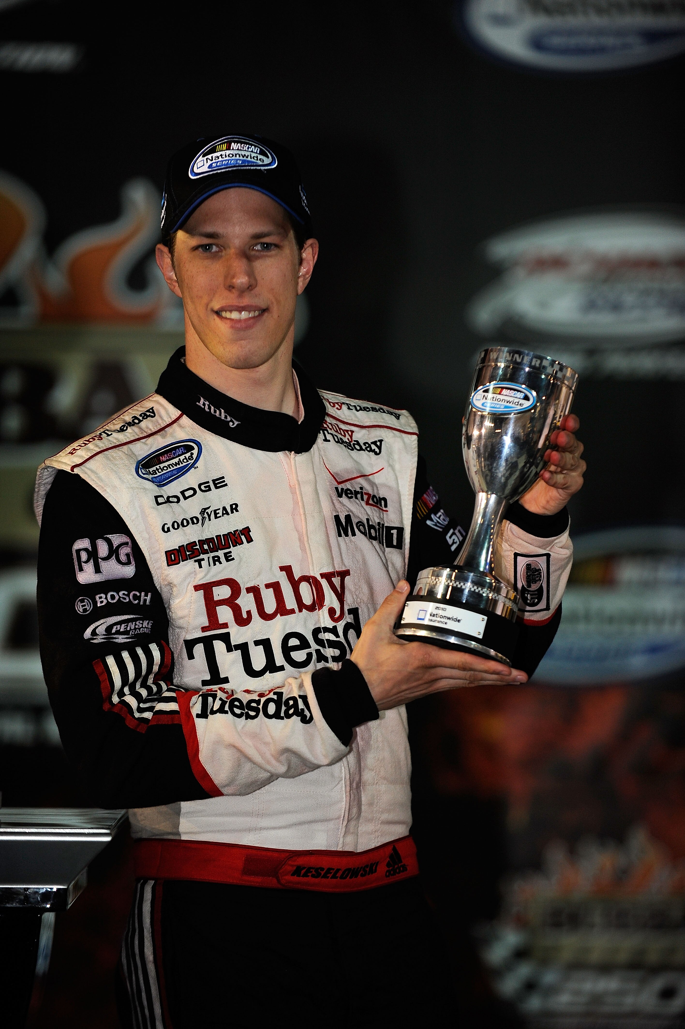 RICHMOND, VA - APRIL 30:  Brad Keselowski, driver of the #22 Ruby Tuesday Dodge, celebrates with the Nationwide trophy in victory lane after winning the NASCAR Nationwide Series BUBBA burger 250 at Richmond International Raceway on April 30, 2010 in Richm