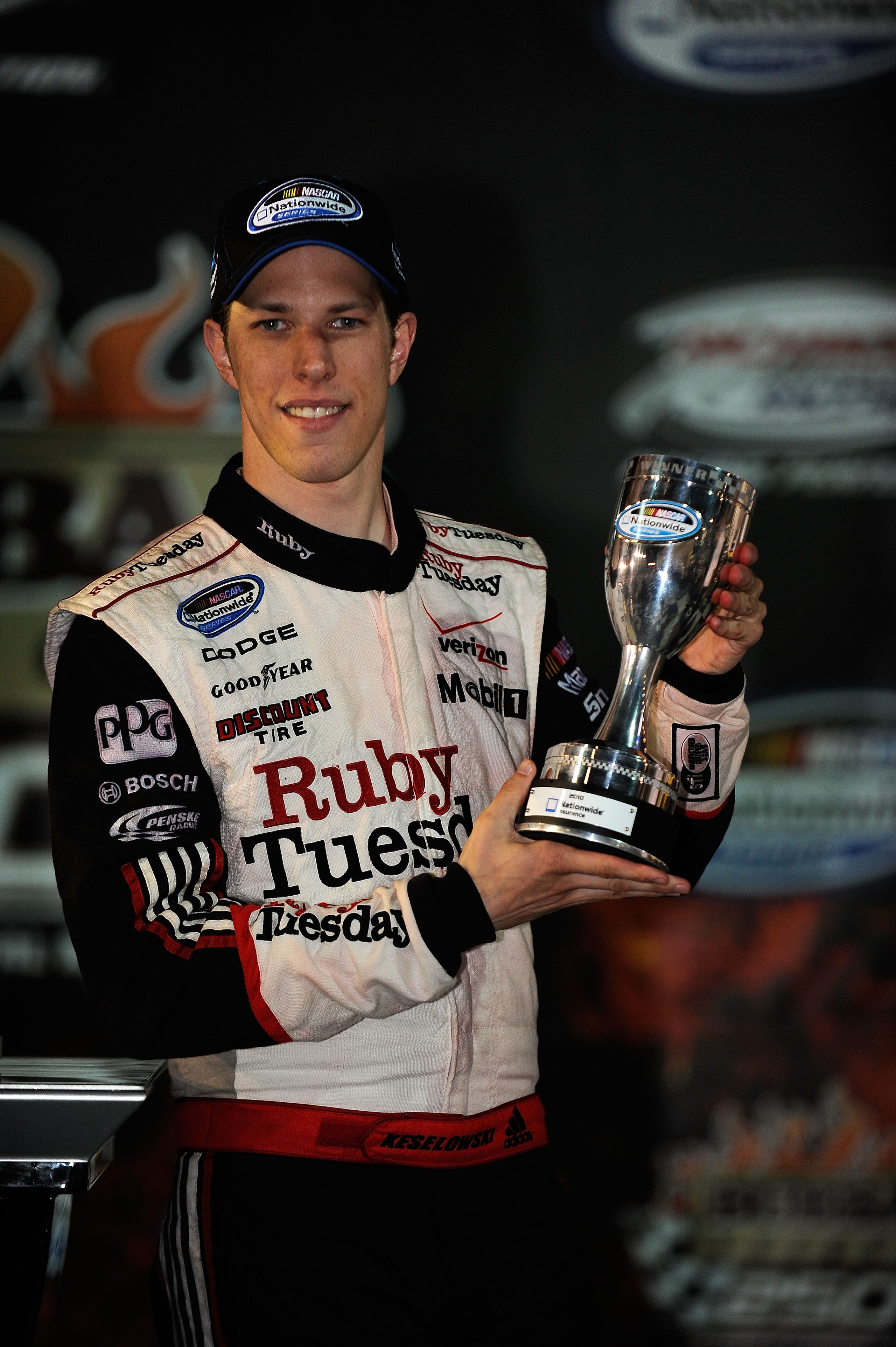 RICHMOND, VA - APRIL 30:  Brad Keselowski, driver of the #22 Ruby Tuesday Dodge, celebrates with the Nationwide trophy in victory lane after winning the NASCAR Nationwide Series BUBBA burger 250 at Richmond International Raceway on April 30, 2010 in Richm