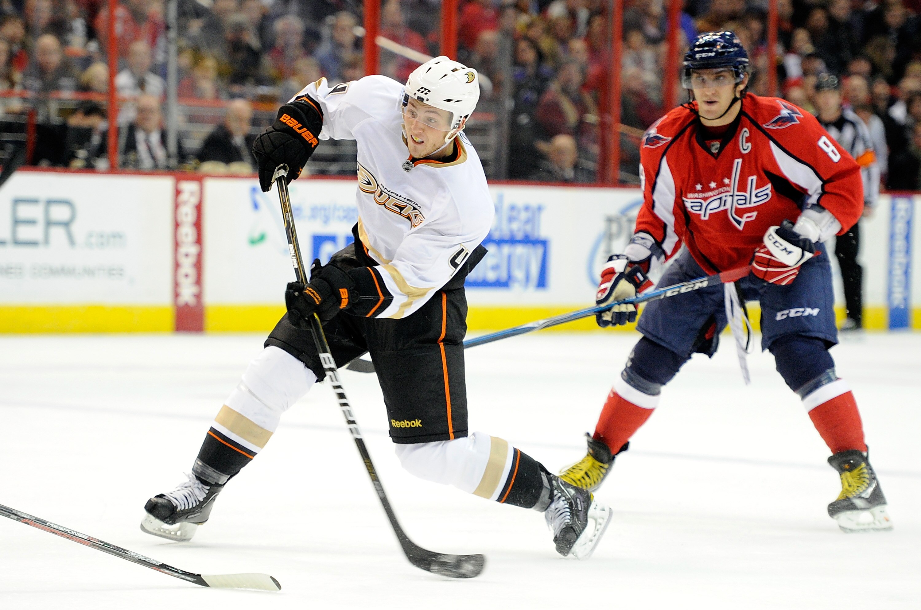 WASHINGTON, DC - DECEMBER 15:  Cam Fowler #4 of the Anaheim Ducks shoots the puck in front of Alex Ovechkin #8 of the Washington Capitals at the Verizon Center on December 15, 2010 in Washington, DC.  (Photo by Greg Fiume/Getty Images)