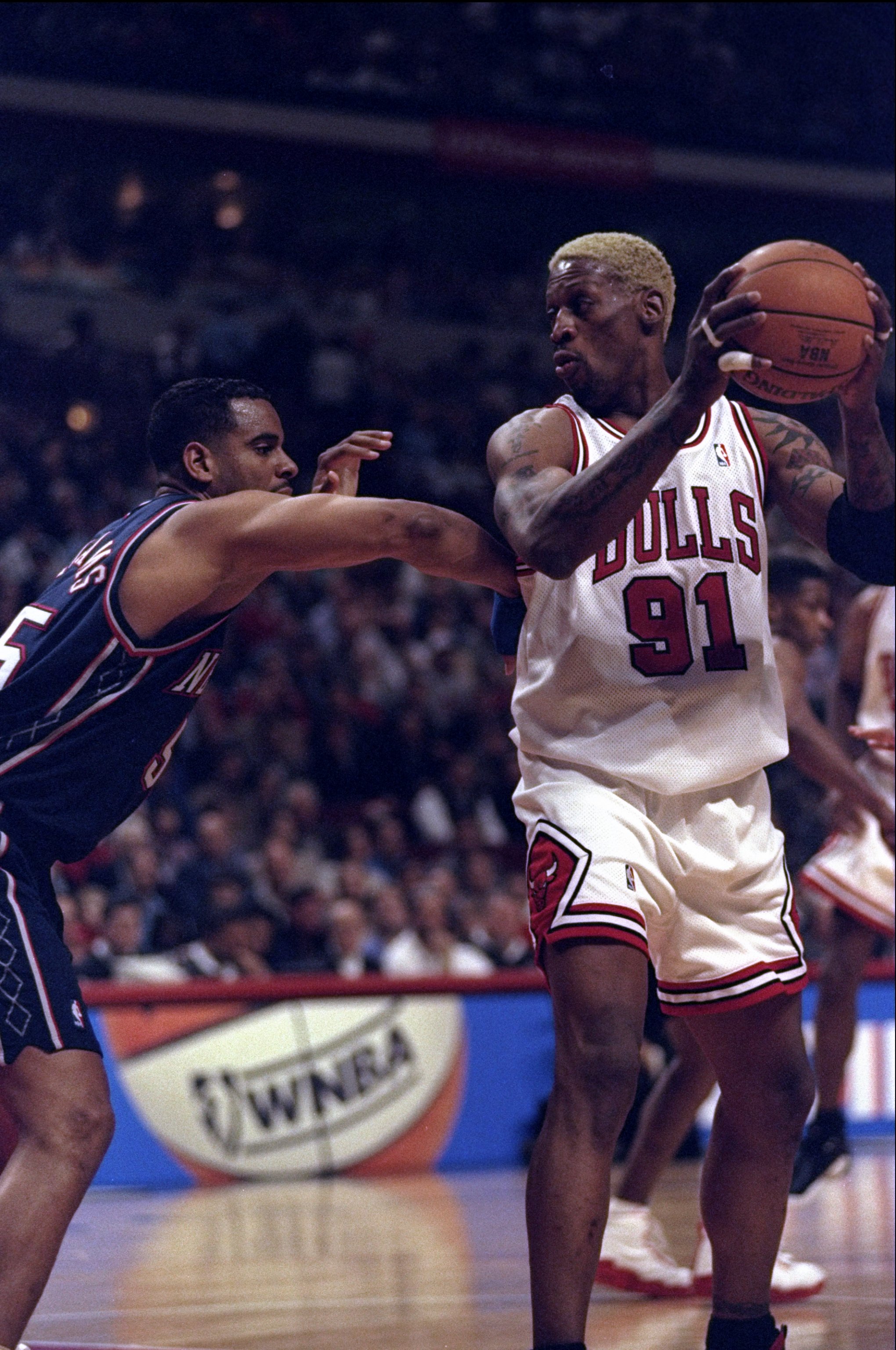 24 Apr 1998: Forward Dennis Rodman of the Chicago Bulls (right) in action against forward Jayson Williams of the New Jersey Nets during a game at the United Center in Chicago, Illinois. The Bulls defeated the Nets 96-93.