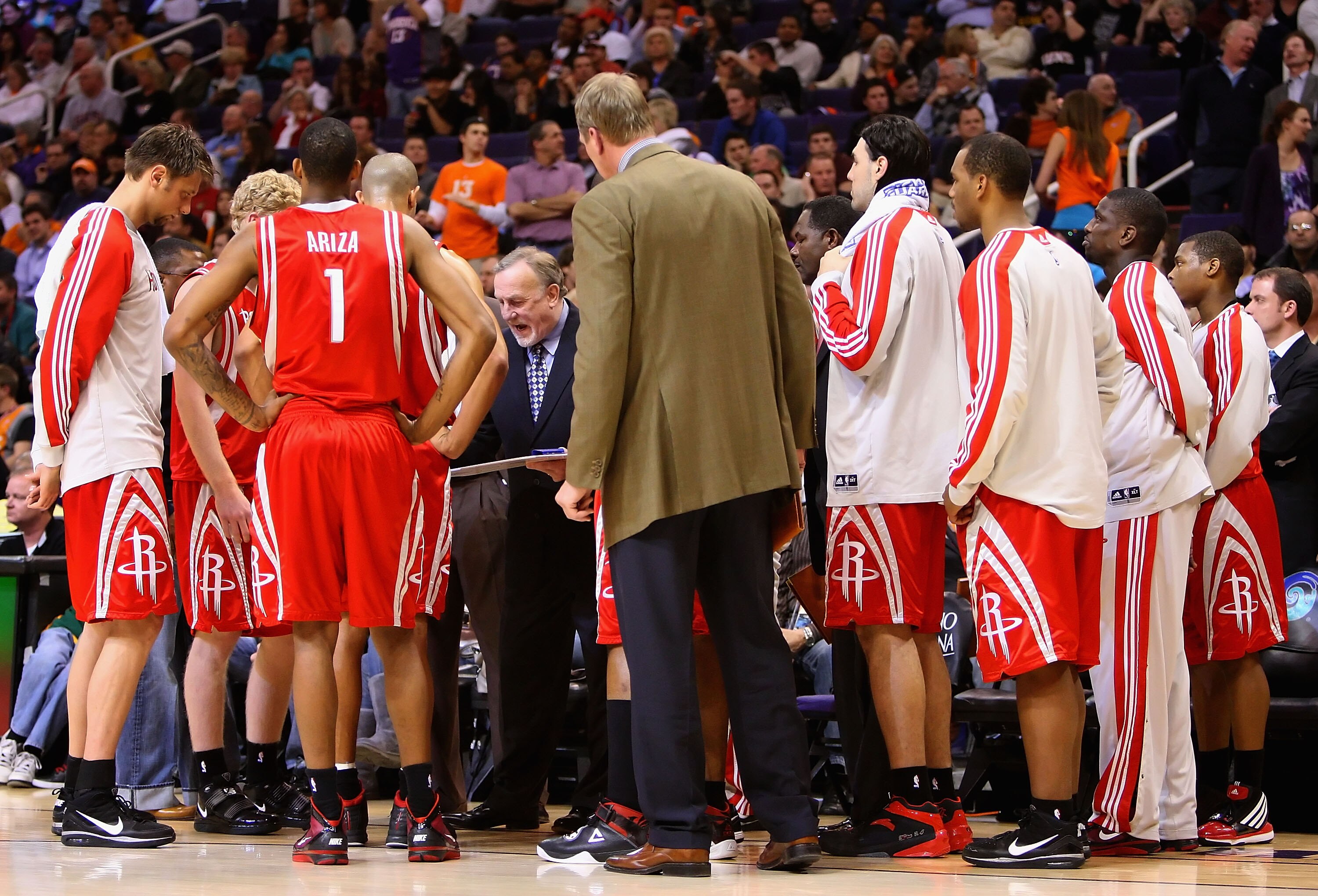 PHOENIX - JANUARY 06:  Head coach Rick Adelman of the Houston Rockets directs his team during a time out from the NBA game against the Phoenix Suns at US Airways Center on January 6, 2010 in Phoenix, Arizona.  The Suns defeated the Rockets 118-110.  NOTE