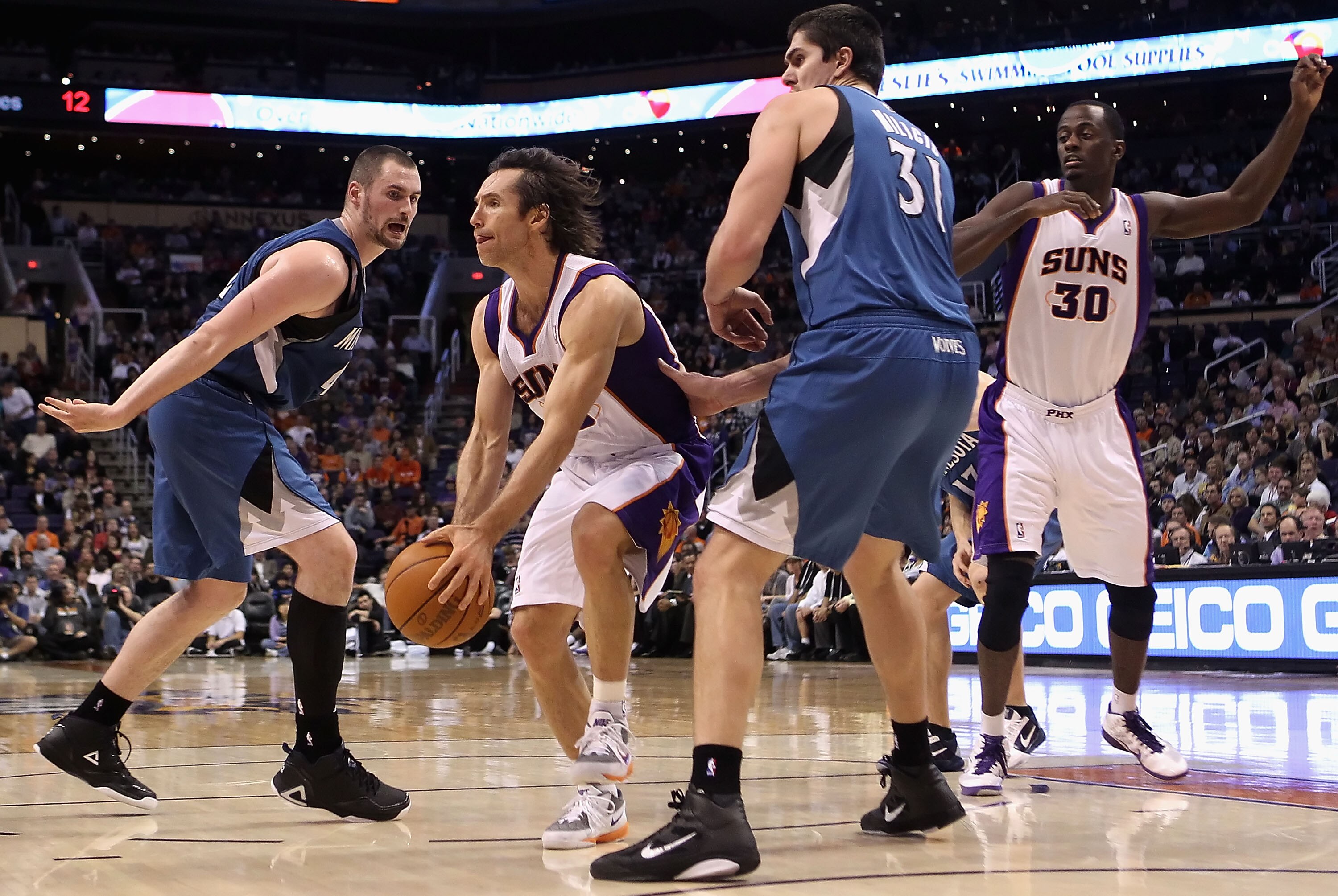 PHOENIX - DECEMBER 15:  Steve Nash #13 of the Phoenix Suns looks to pass the ball during the NBA game against the Minnesota Timberwolves at US Airways Center on December 15, 2010 in Phoenix, Arizona.  The Suns defeated the Timberwolves 128-122.  NOTE TO U
