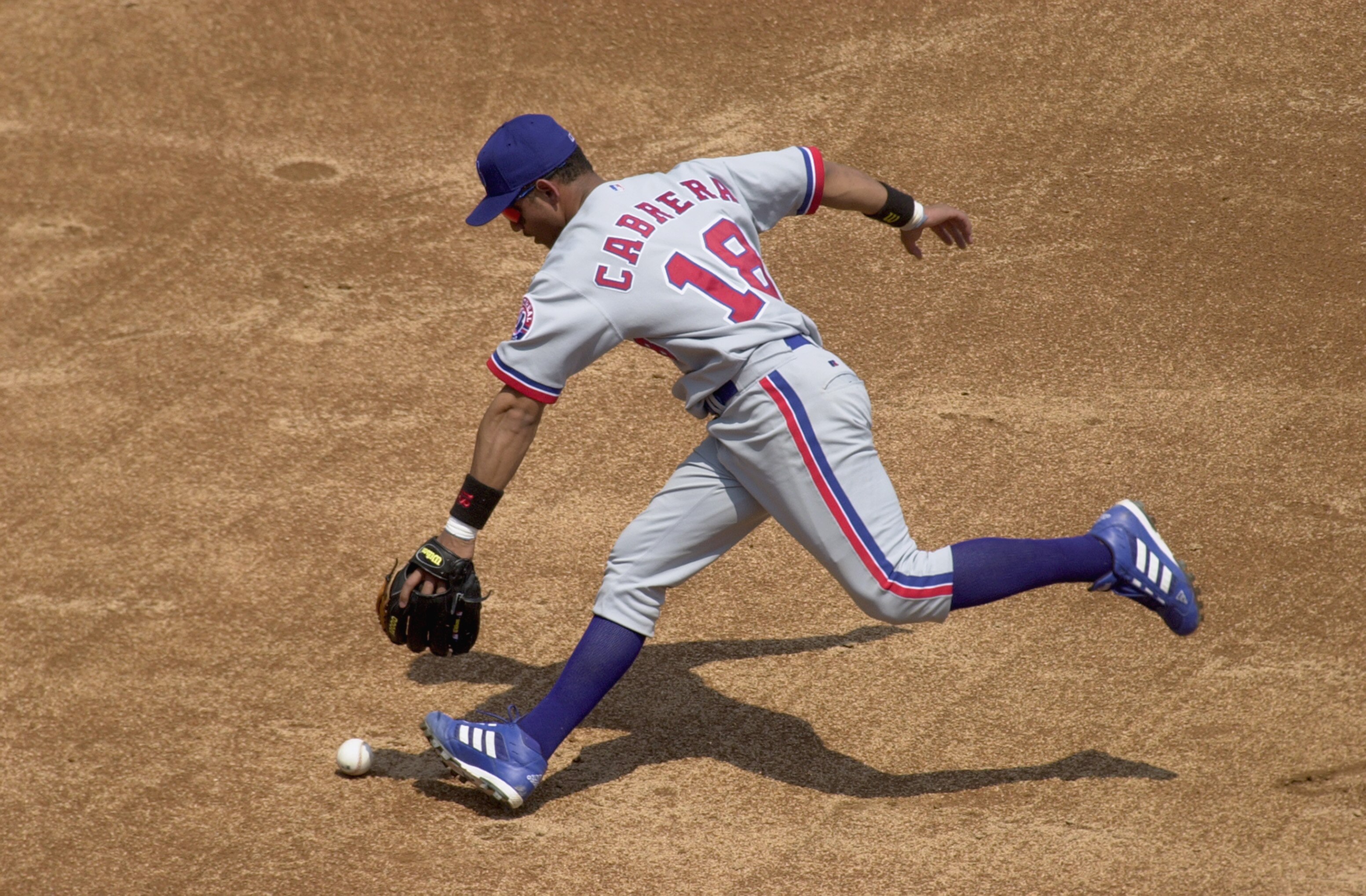 CHICAGO- June 9:  Shortstop Orlando Cabrera #18 of the Montreal Expos bobbles the ball and is charged with an error against the Chicago White Sox during their game at Comiskey Park in Chicago, Illinois on June 9, 2002. The White Sox defeated the Expos 13-