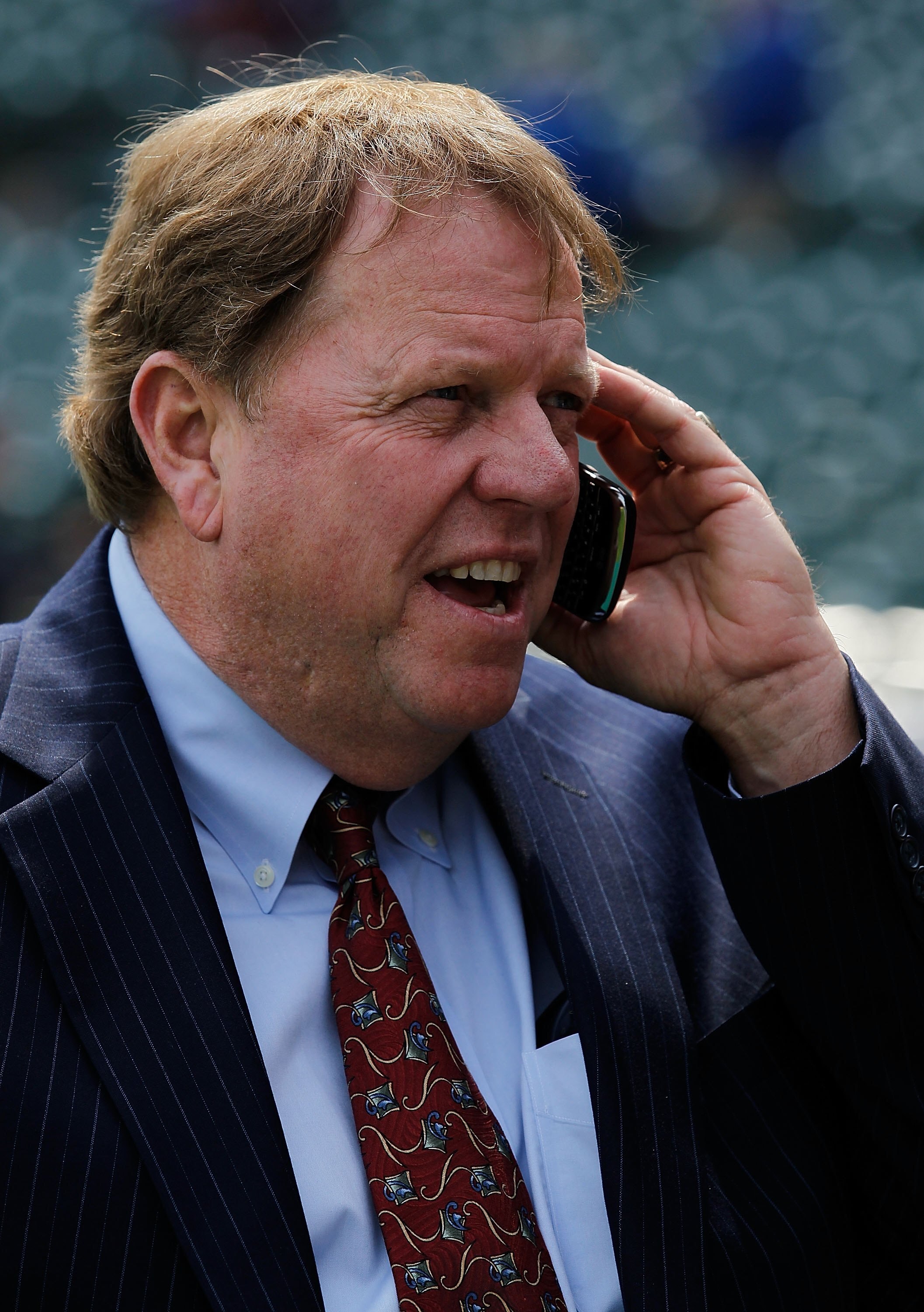 CHICAGO - APRIL 12: General manager Jim Hendry of the Chicago Cubs works the phone before the Opening Day game against the Milwaukee Brewers at Wrigley Field on April 12, 2010 in Chicago, Illinois. (Photo by Jonathan Daniel/Getty Images)