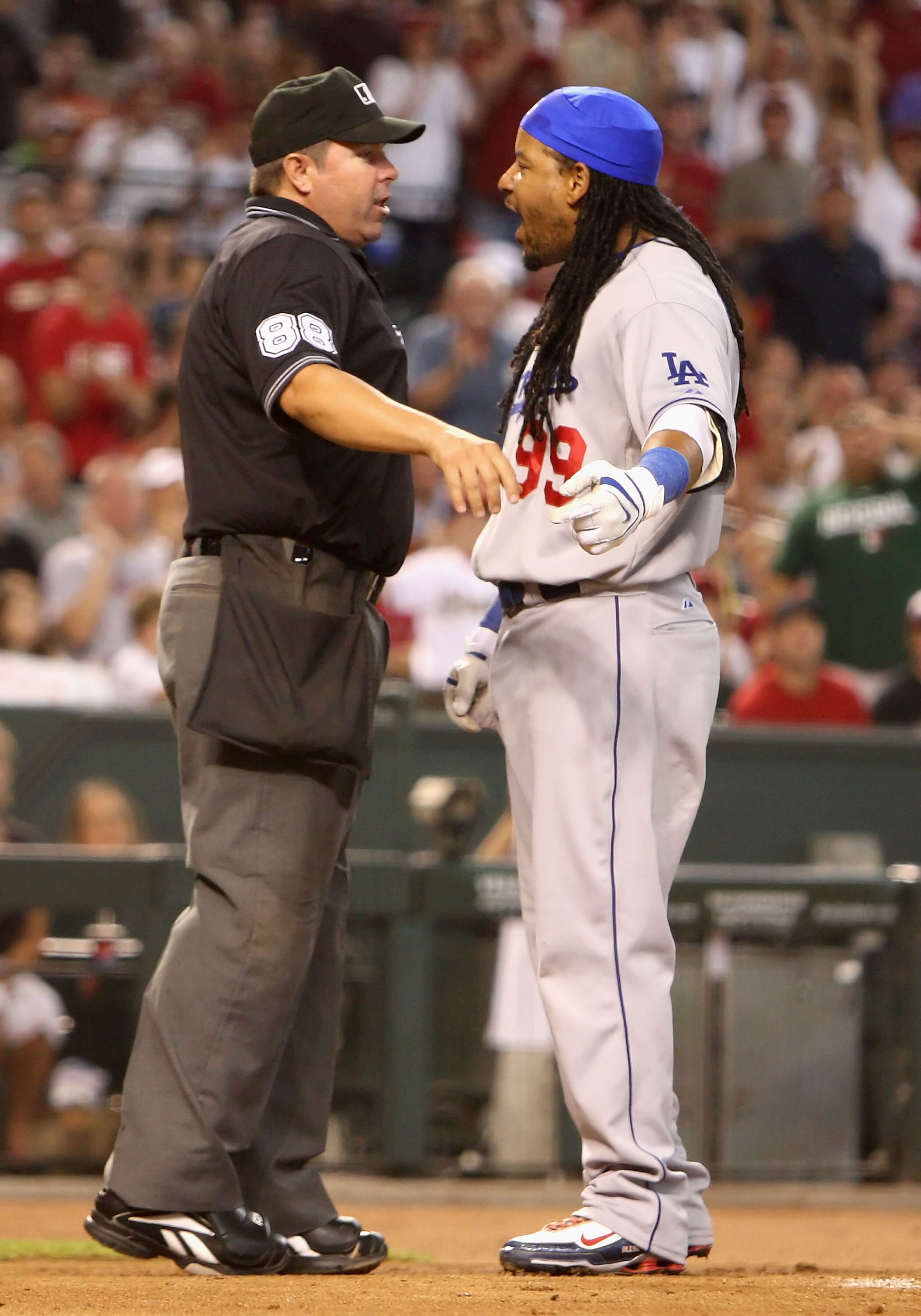PHOENIX - SEPTEMBER 07:  Manny Ramirez #99 of the Los Angeles Dodgers argues with home plate umpire Doug Eddings after being ejected during the major league baseball game against the Arizona Diamondbacks at Chase Field on September 7, 2009 in Phoenix, Ari