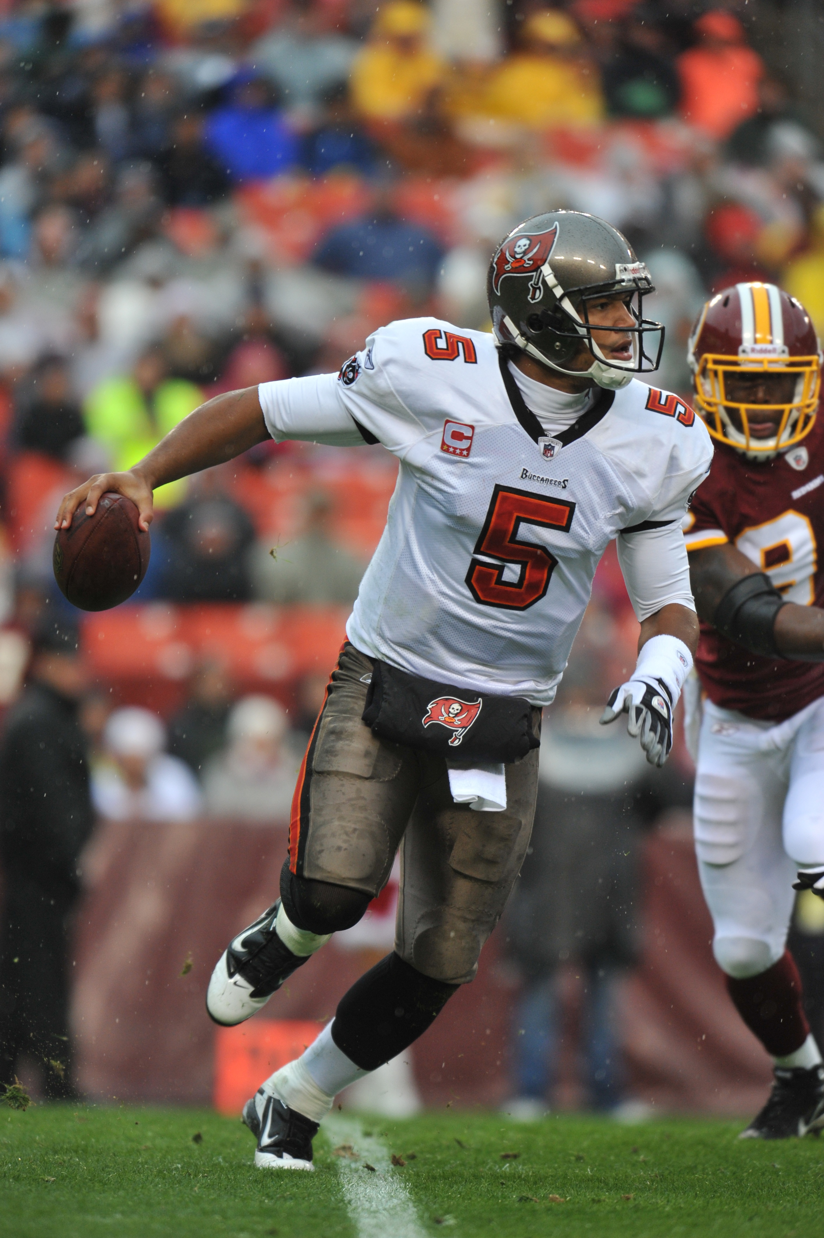 LANDOVER, MD - DECEMBER 12:  Josh Freeman #5 of the Tampa Bay Buccaneers scrambles during the game against the Washington Redskins  at FedExField on December 12, 2010 in Landover, Maryland. The Buccaneers defeated the Redskins 17-16. (Photo by Larry Frenc